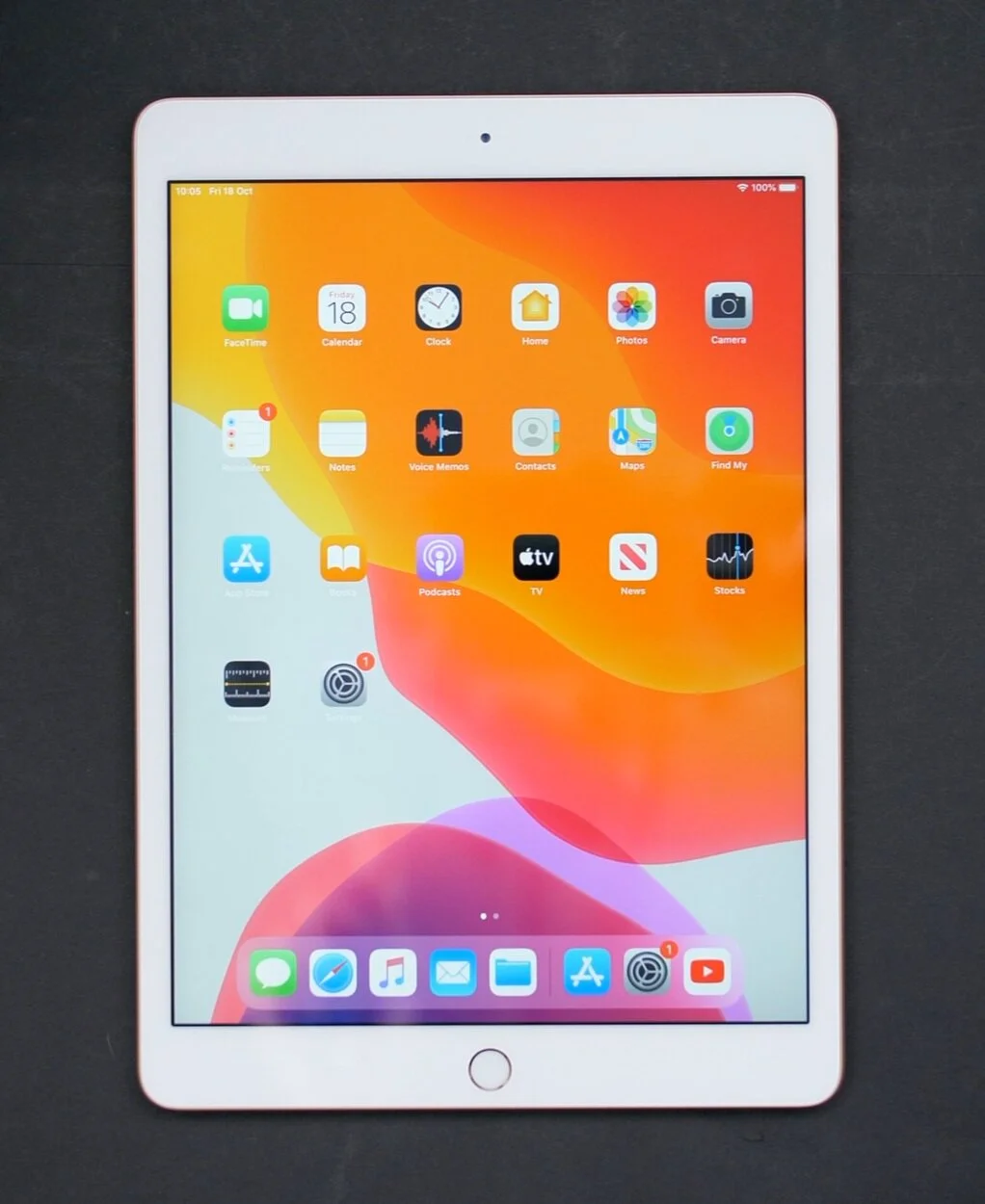 The six year old design of the 10.” iPad features thick bezels and a home button