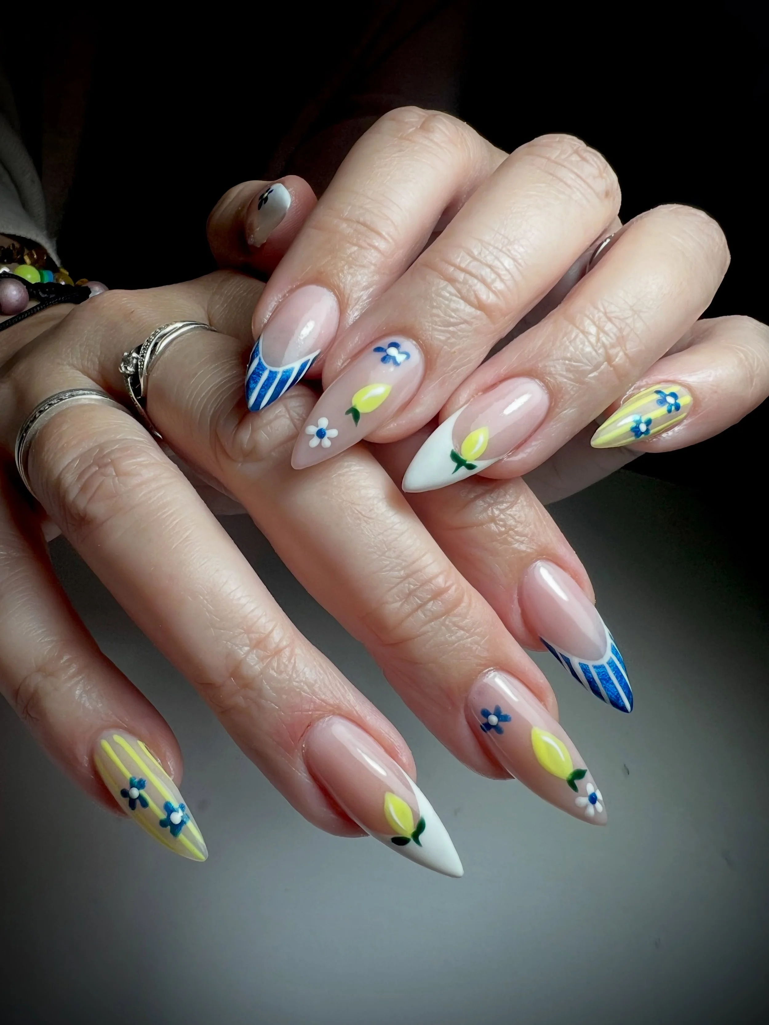 When life gives you lemons&hellip; put them on your nails 🍋💙✨

Obsessed is an understatement for this fresh little set 😮&zwj;💨 Cute lemon details, tiny florals, bold striped French tips and the DREAMIEST glossy finish. Giving Italian summer meets