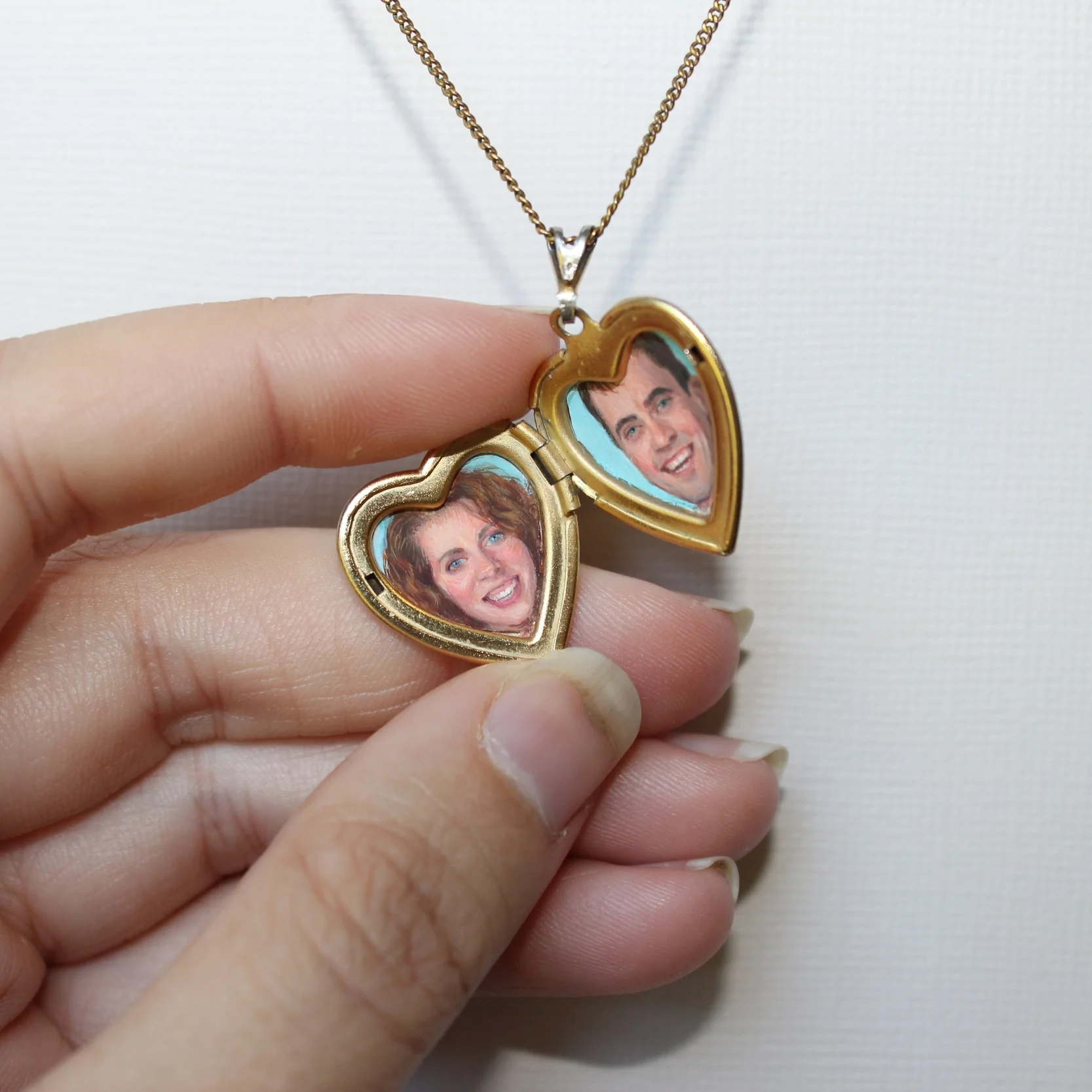 Anniversary locket , gouache on paper in locket, two 1/2"x1/2" hearts, 2015 by Diana Corvelle