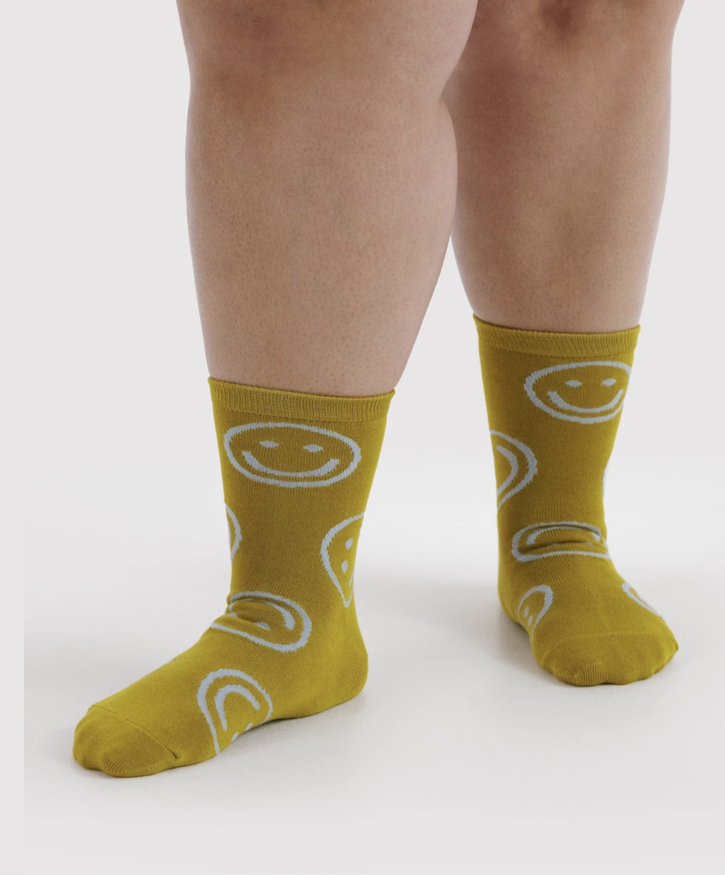 Baggu socks ochre happy styled.png