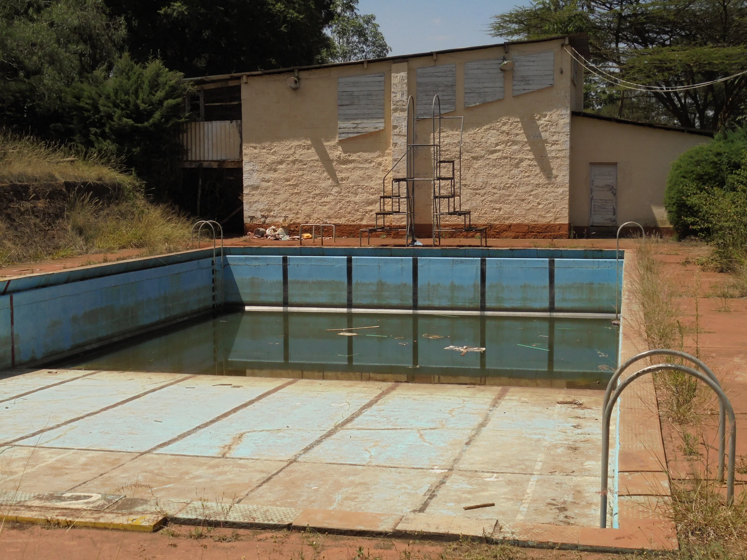 The current state of the school pool and squash courts