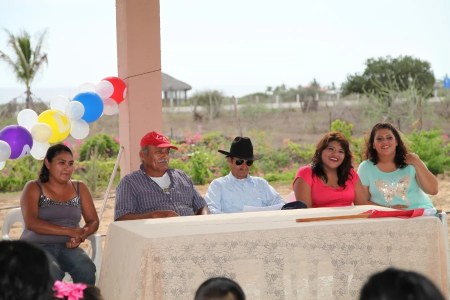 Some of the parents of the kids, the Subdelgado and the "Bossy Lady"