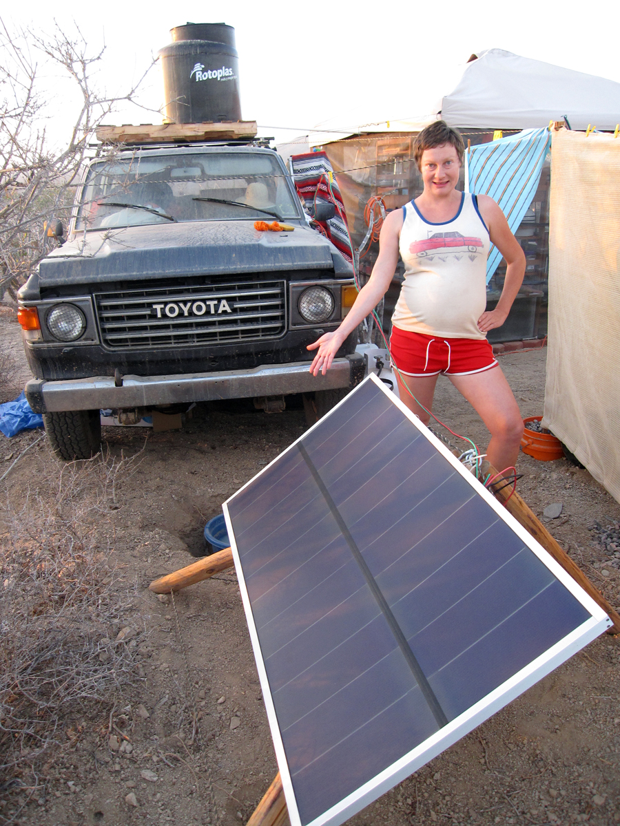 Showing off our solar panel at our camp.
