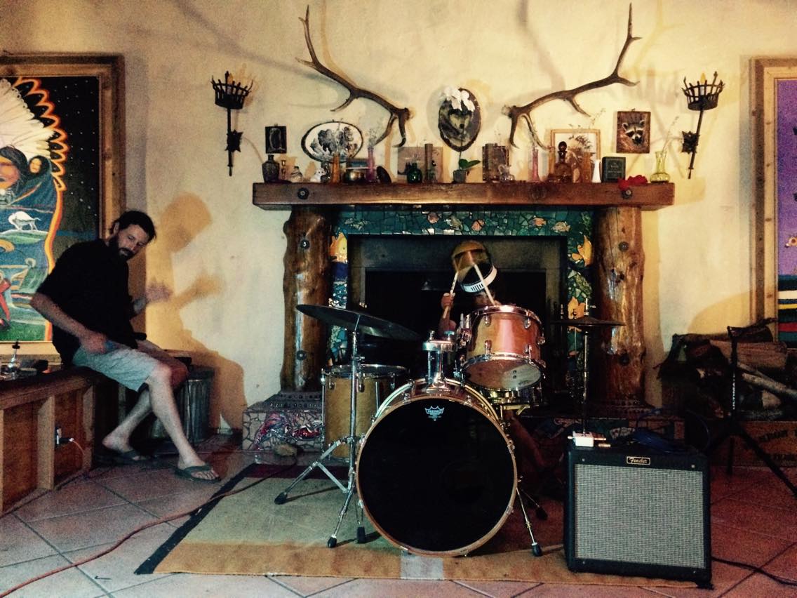 Rock Star/Ethnomusicologist Dave Novak and his kid Finn warming up the drums
