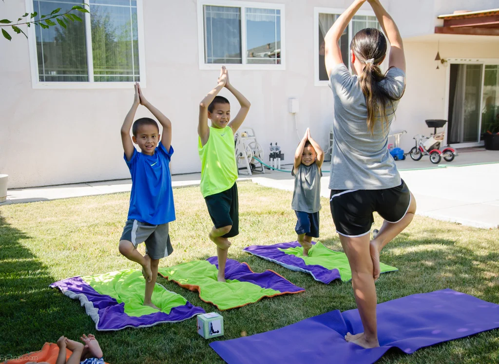 Yoga in the shade and baby feet photo bombing the shot. 