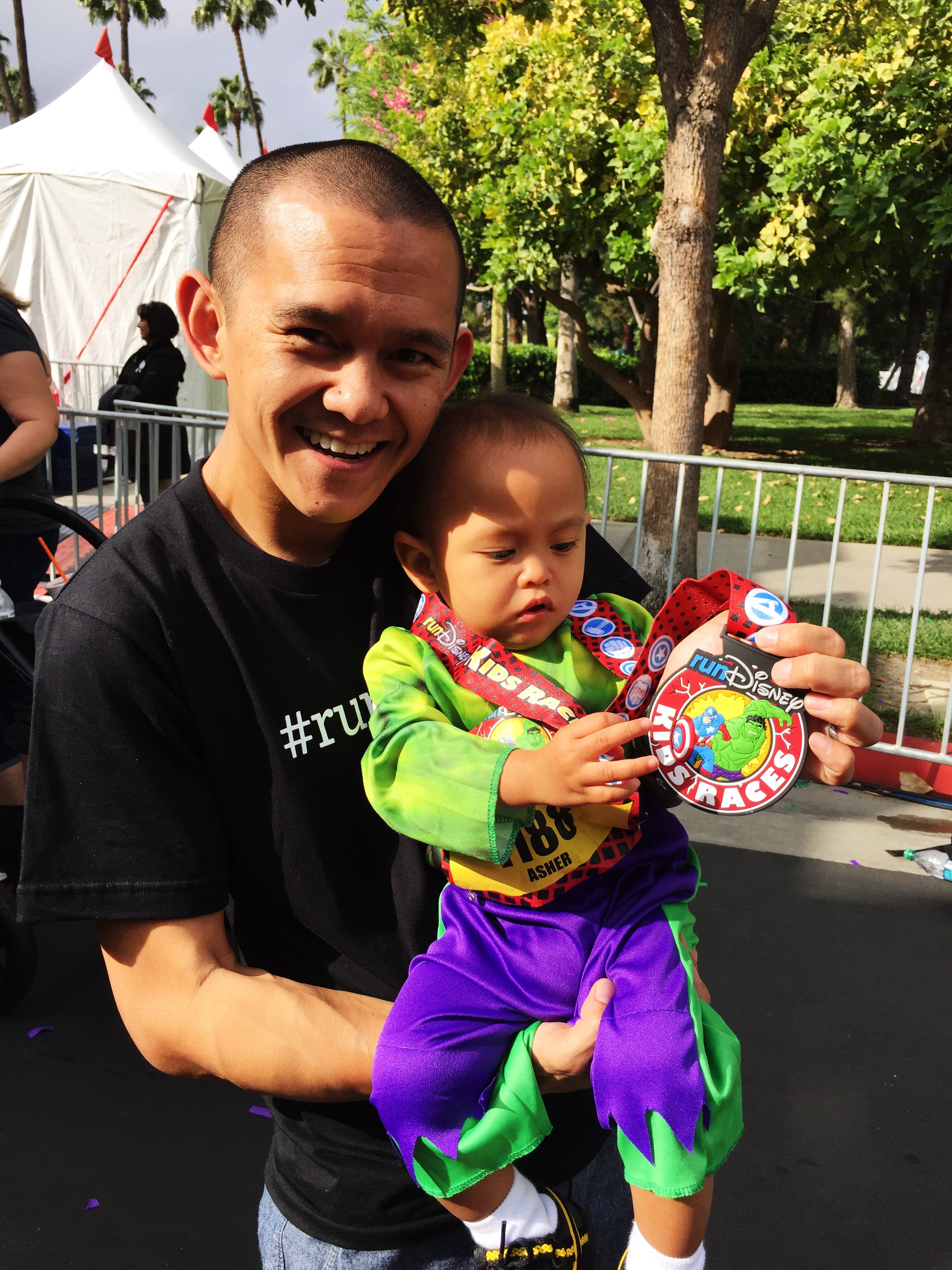 Asher admiring his race bling.