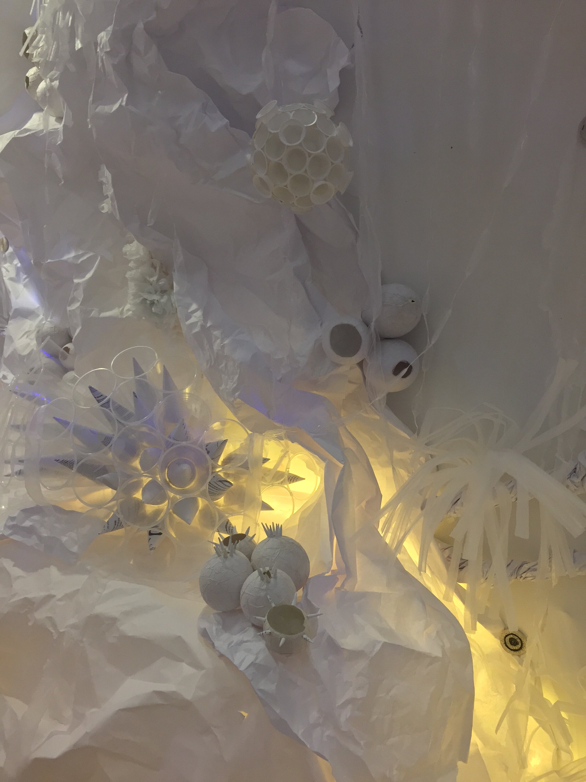  a detail including sponges made with paper and plastic bags, coral with plastic cups and paper cones  and anemones made of styrofoam sheets 