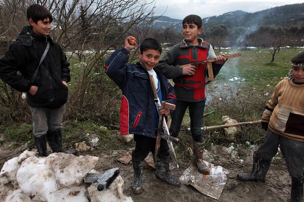   Syrian children play with home-made toy gun&nbsp; Times photographer, Tom Pilston 