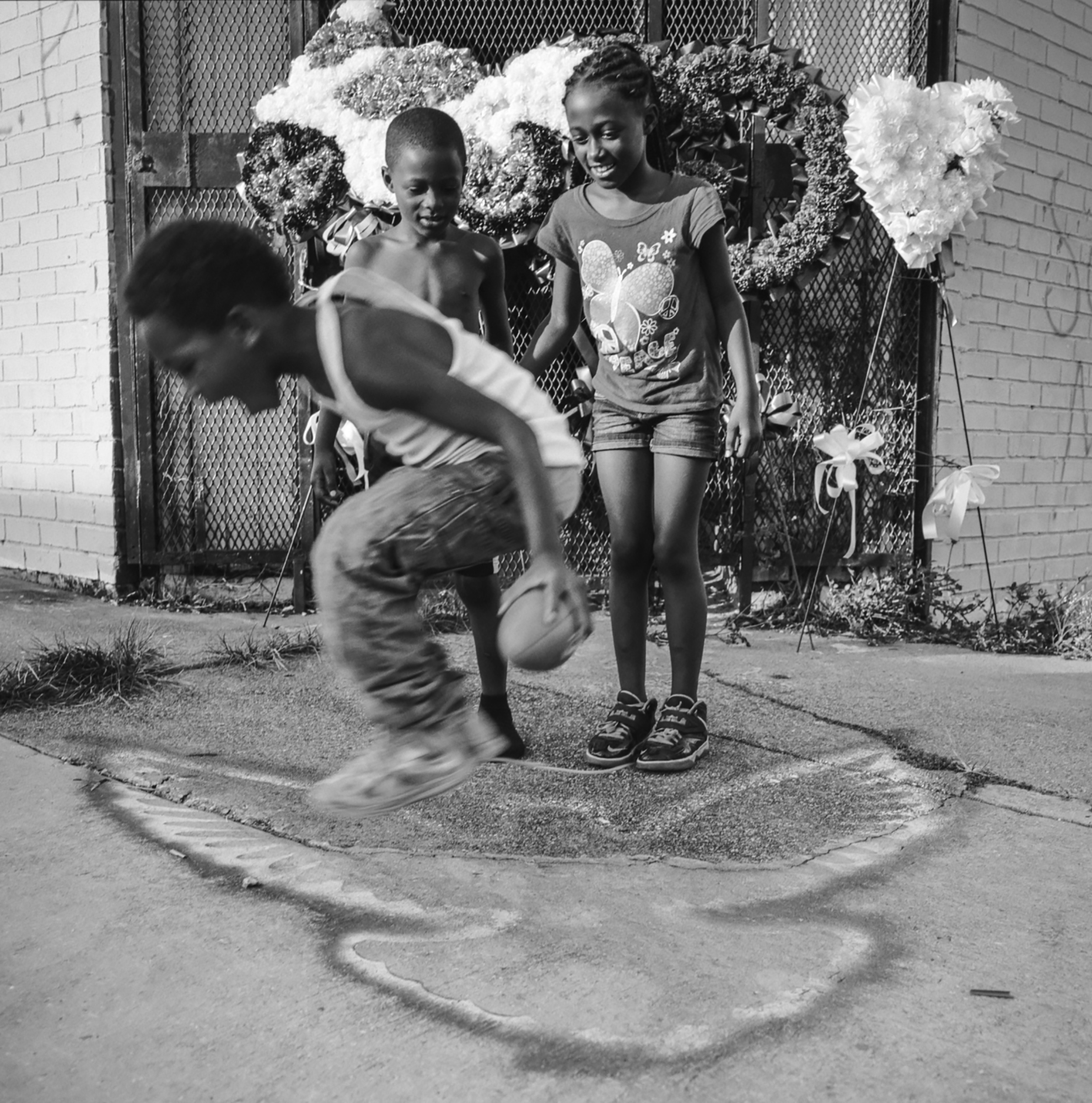 Kids playing aside a makeshift shrine New Orleans, 2014    1:1  