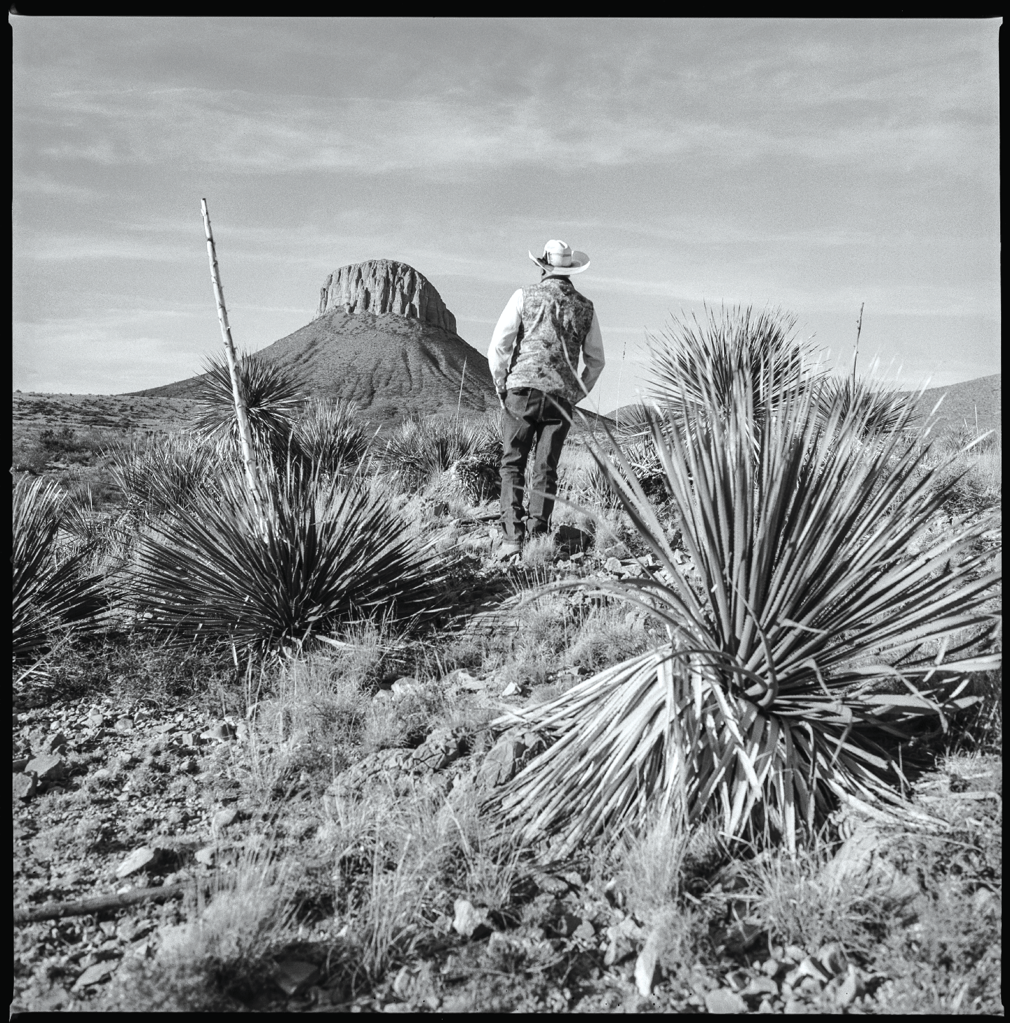 Man surveying land Hudspeth County, 2017 Made with Hasselblad 501c with Kodak Tri-X 400 b&w film