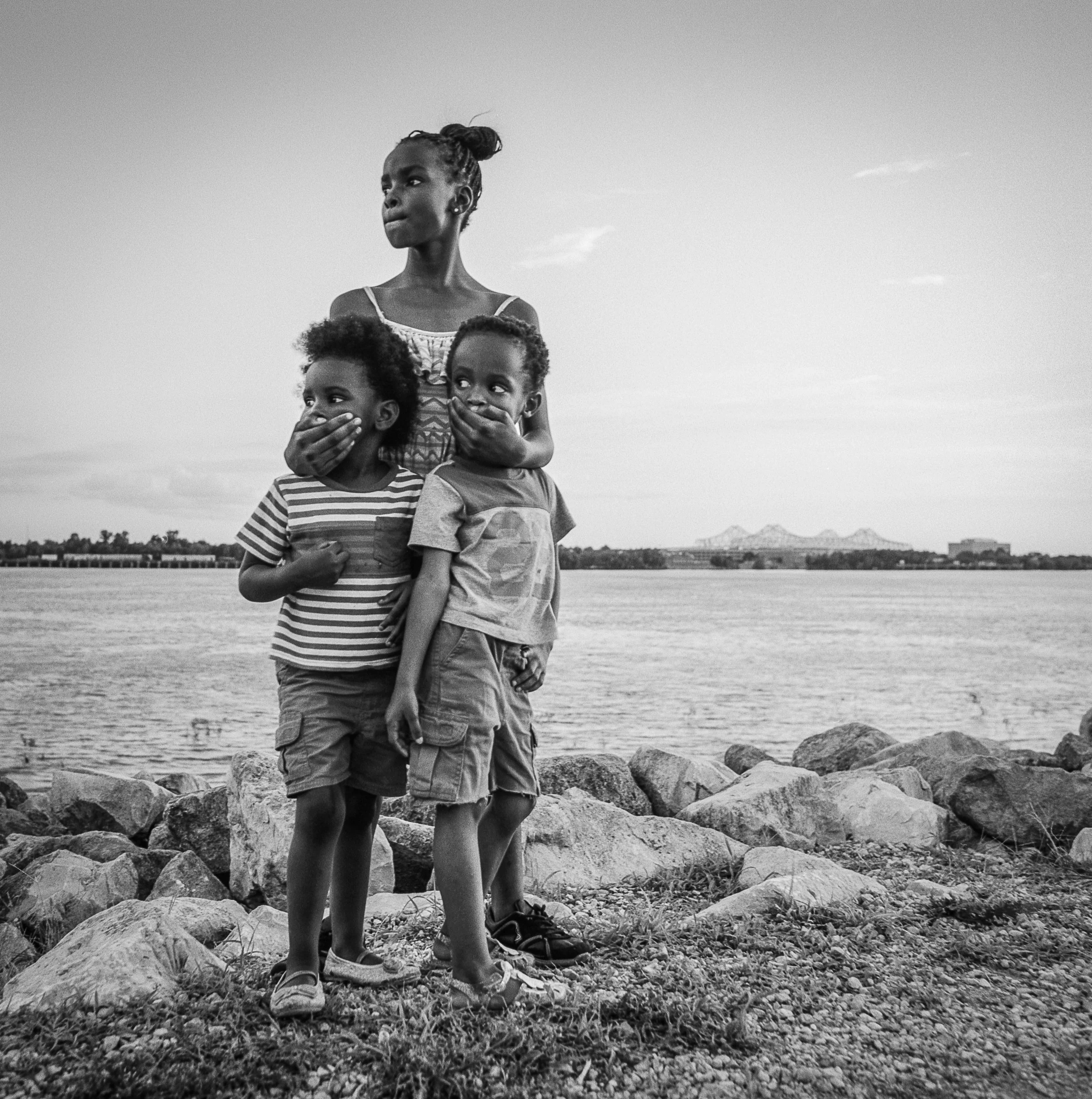 3 siblings along the Mississippi River New Orleans, 2018