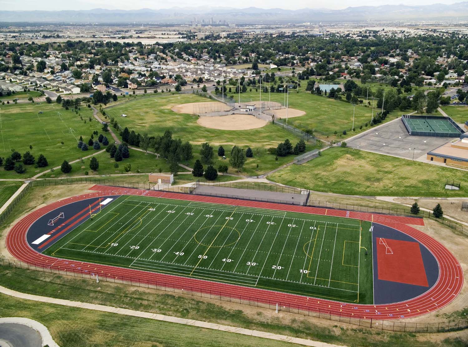 MONTBELLO FIELDS - Mechanical, electrical and site renovation of 6 schools, including the Montbello High School synthetic turf football field.