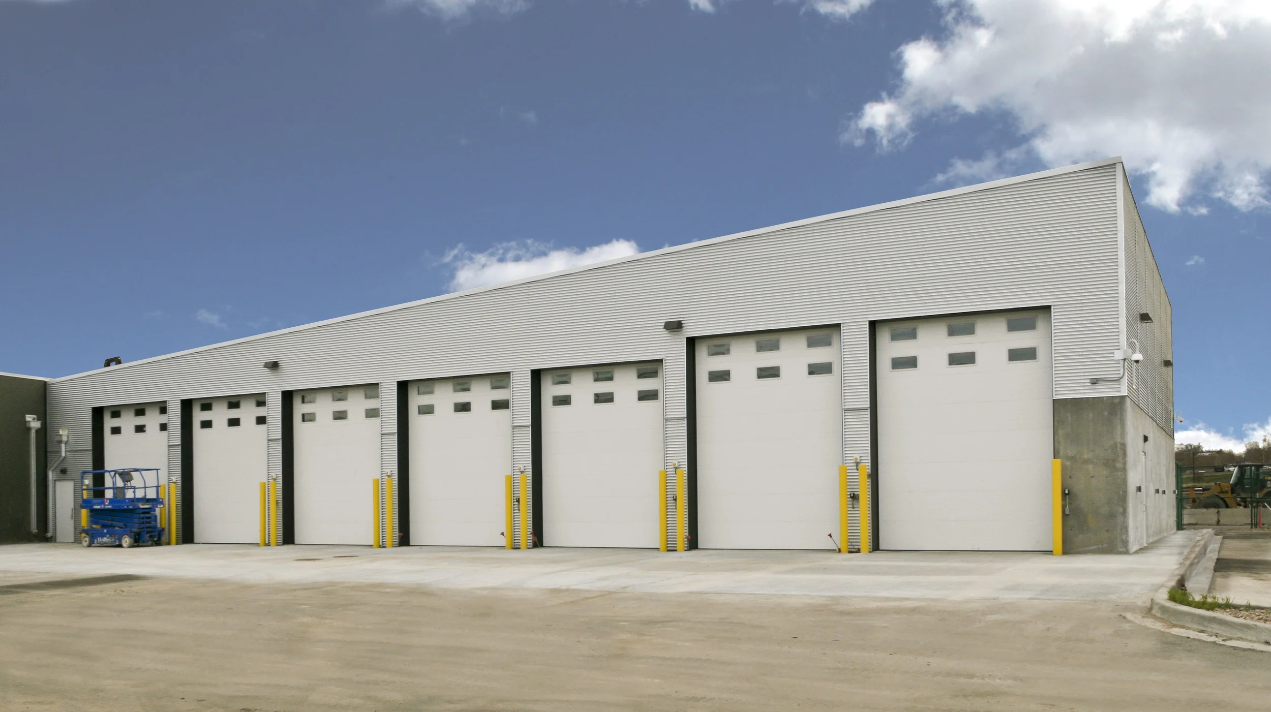 DPD COMMAND GARAGE - A 7,500 SF addition to the existing DPD firing range to be used for the storage of large command vehicles. The building is made of structural steel with a corrugated metal wall skin.