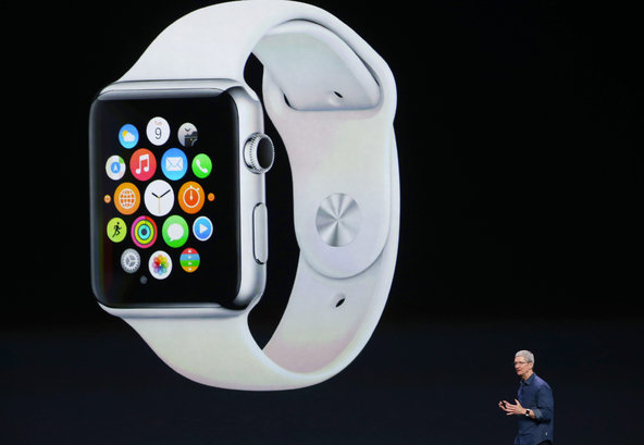 Apple Inc. CEO Tim Cook shows off the Apple Watch during the company's keynote in California on September 9, 2014.