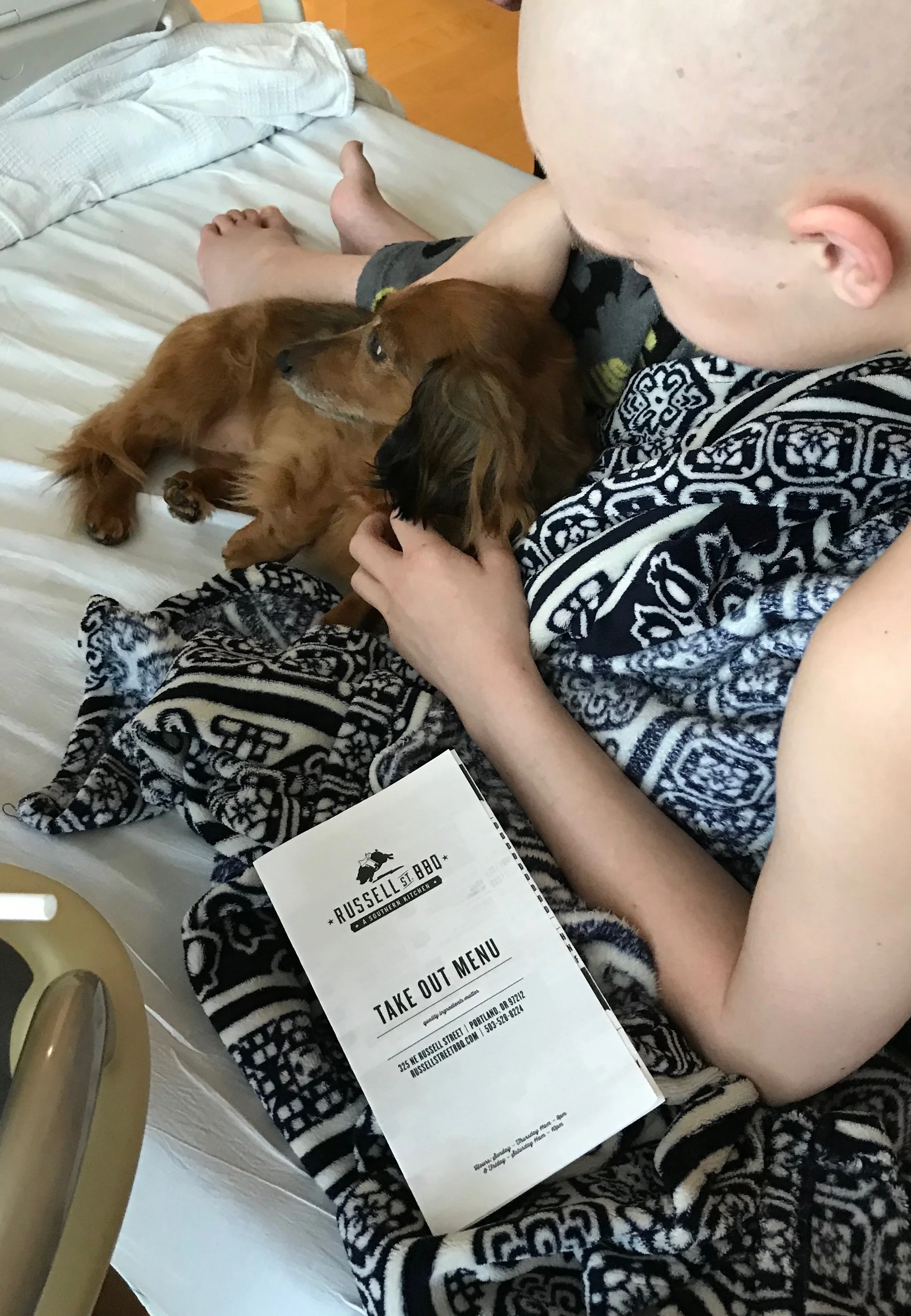 Checking out the menu but got a happy surprise visit from a cute dog!&nbsp;
