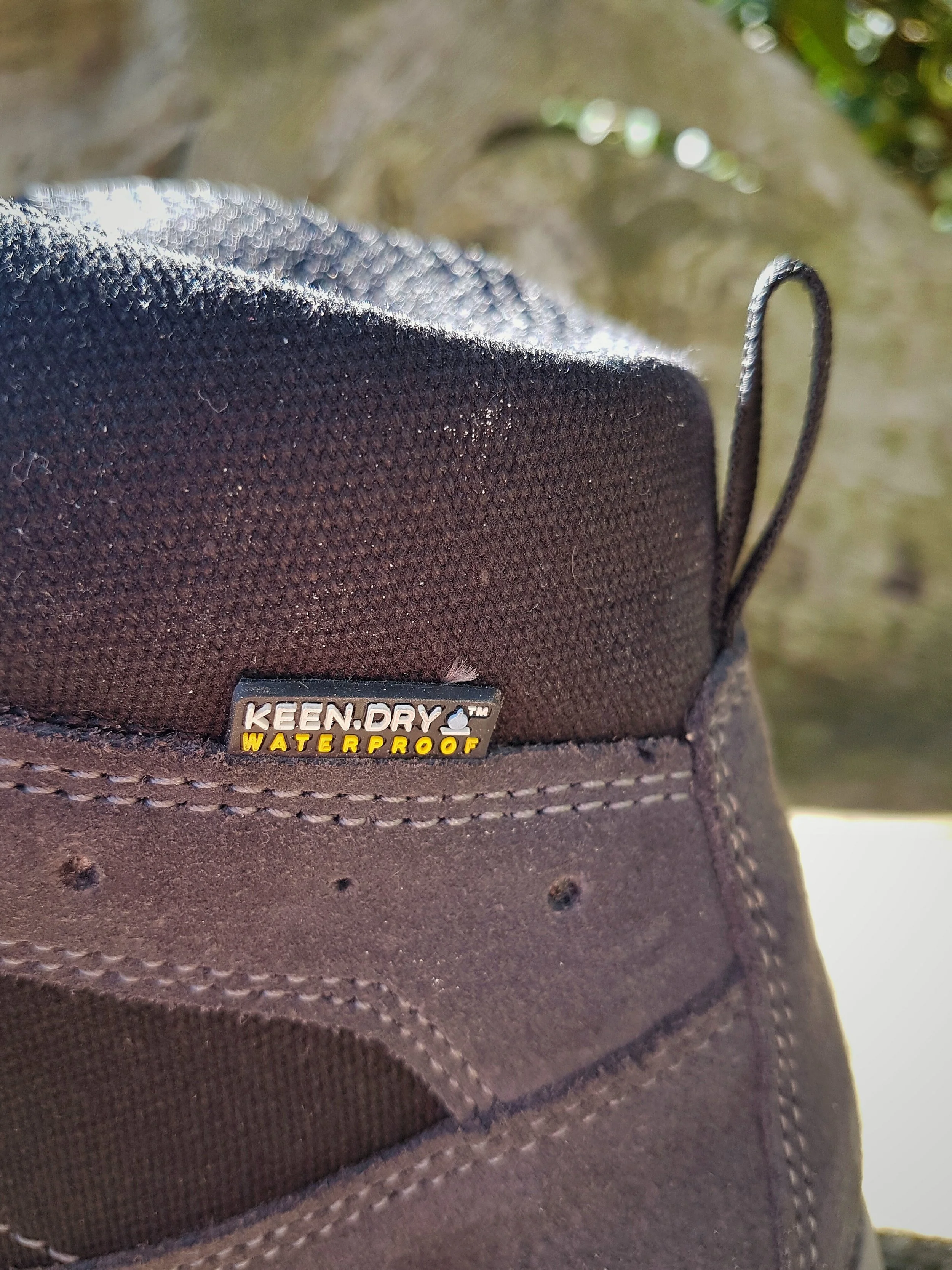 KEEN Waterproofing is clearly visible on the outside of the boot, close to the heel area. The materials on the outer part of the boot are robust mesh and canvas.