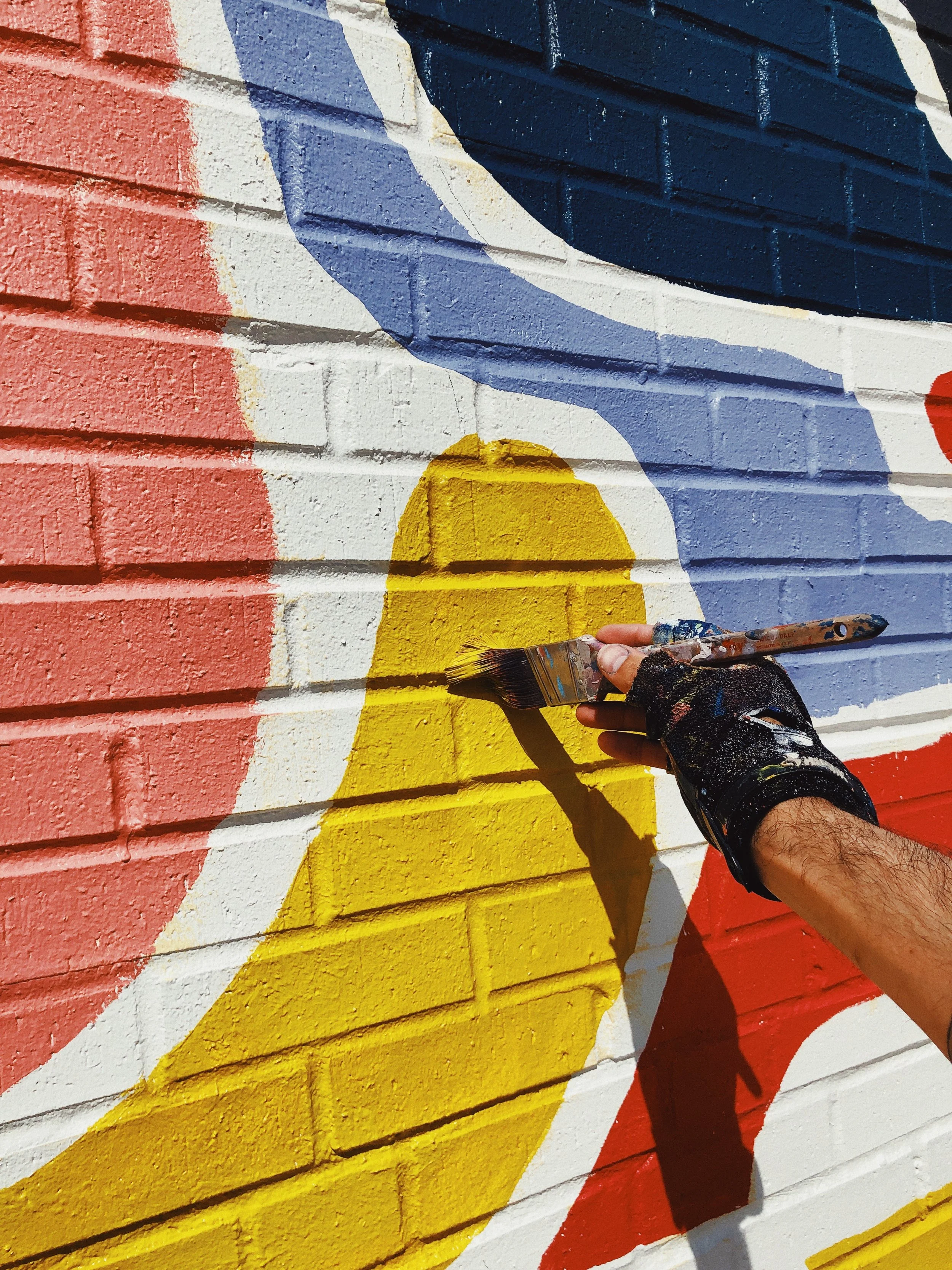 Kyle Steed painting mural at Firehouse.GP in Grand Prairie, TX