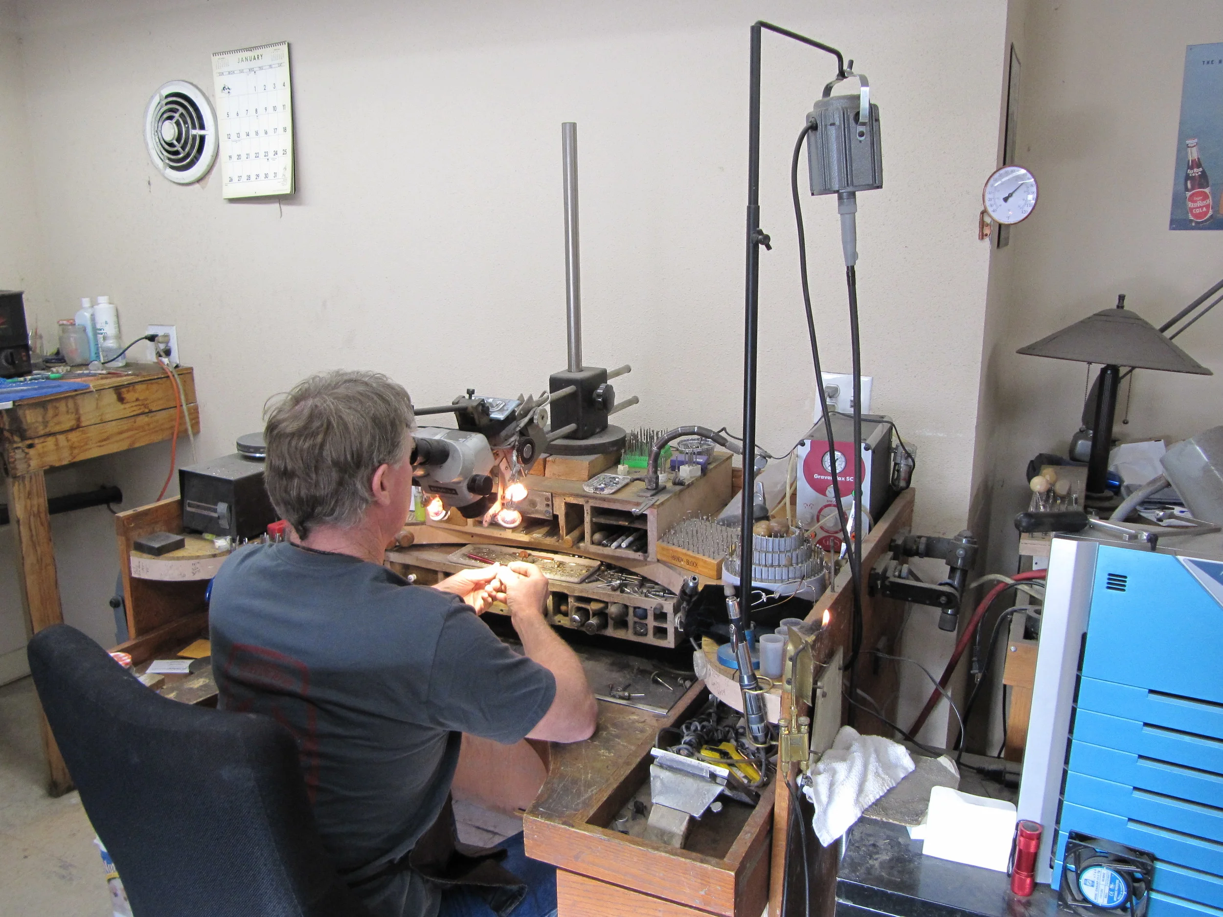 Jeweler Sitting At Work Bench.JPG