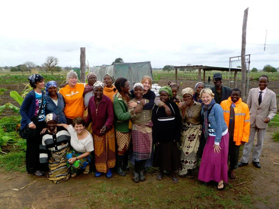 Jamie Fuller, far left, celebrates the sowing of new seeds at the Muhambe agriculture field in Mozambique. The field was made possible through contributions to the first Very Special Purse Party held in October 2011.
Normal
0
false
false
false
EN-US
X-NONE
X-NONE
/* Style Definitions */
table.MsoNormalTable
{mso-style-name:"Table Normal";
mso-tstyle-rowband-size:0;
mso-tstyle-colband-size:0;
mso-style-noshow:yes;
mso-style-priority:99;
mso-style-parent:"";
mso-padding-alt:0in 5.4pt 0in 5.4pt;
mso-para-margin-top:0in;
mso-para-margin-right:0in;
mso-para-margin-bottom:10.0pt;
mso-para-margin-left:0in;
line-height:115%;
mso-pagination:widow-orphan;
font-size:11.0pt;
font-family:"Calibri","sans-serif";
mso-ascii-font-family:Calibri;
mso-ascii-theme-font:minor-latin;
mso-hansi-font-family:Calibri;
mso-hansi-theme-font:minor-latin;}