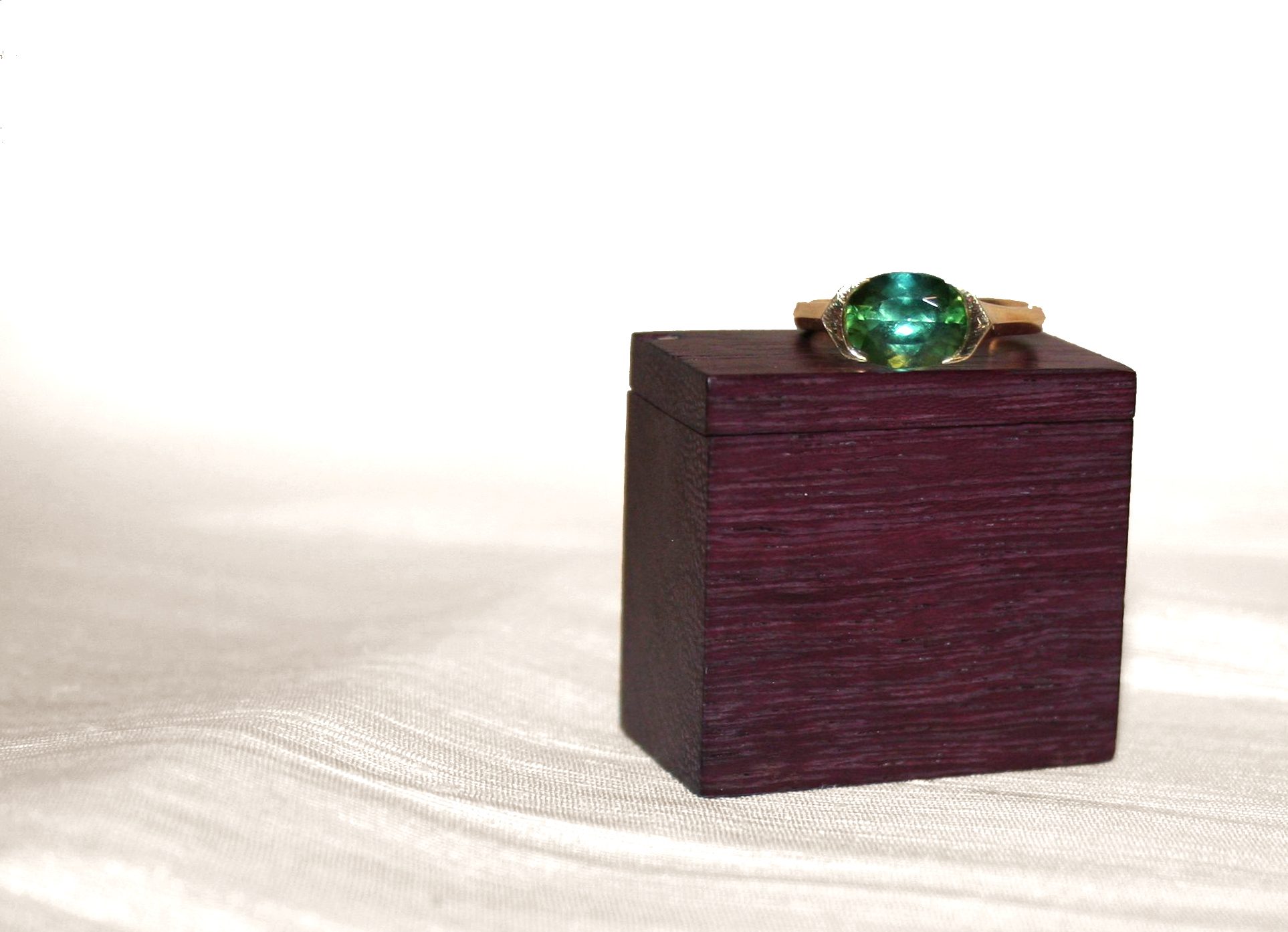 PURPLEHEART RING BOX, 2011. Purpleheart felt, magnet, silver rivet.