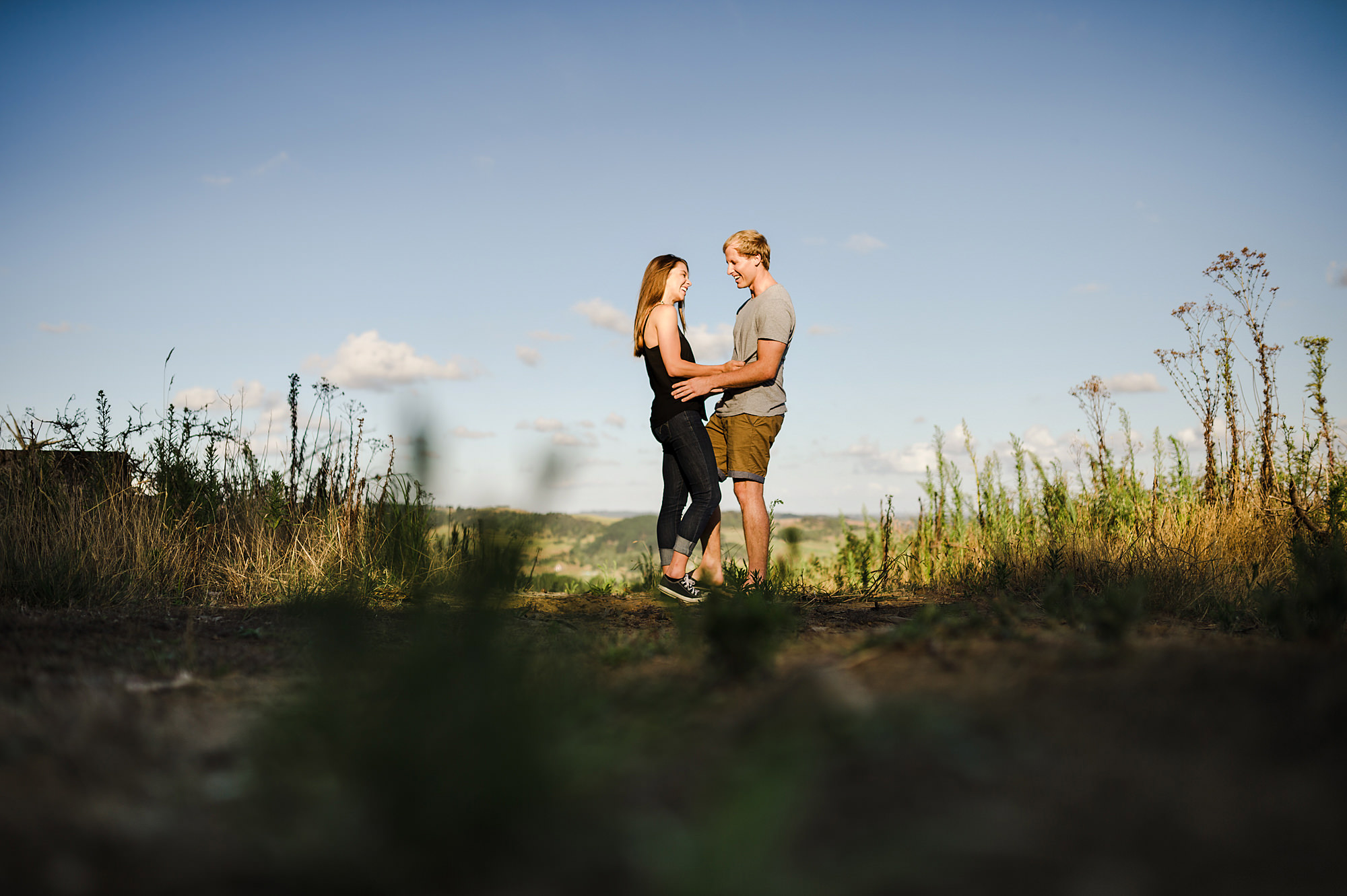 2 couple in love laughing in field.jpg