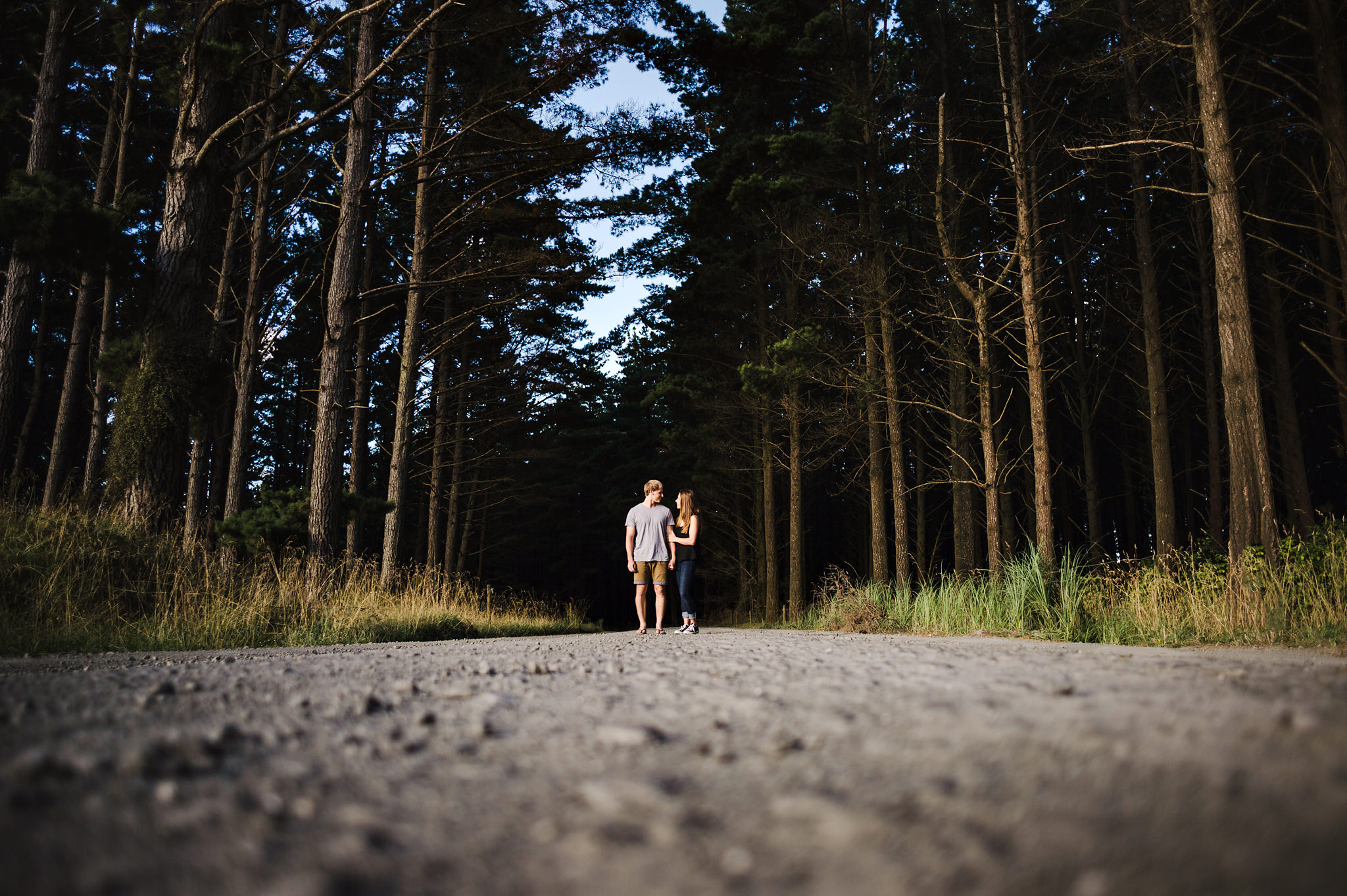 3a couple in middle of road next to woods.jpg