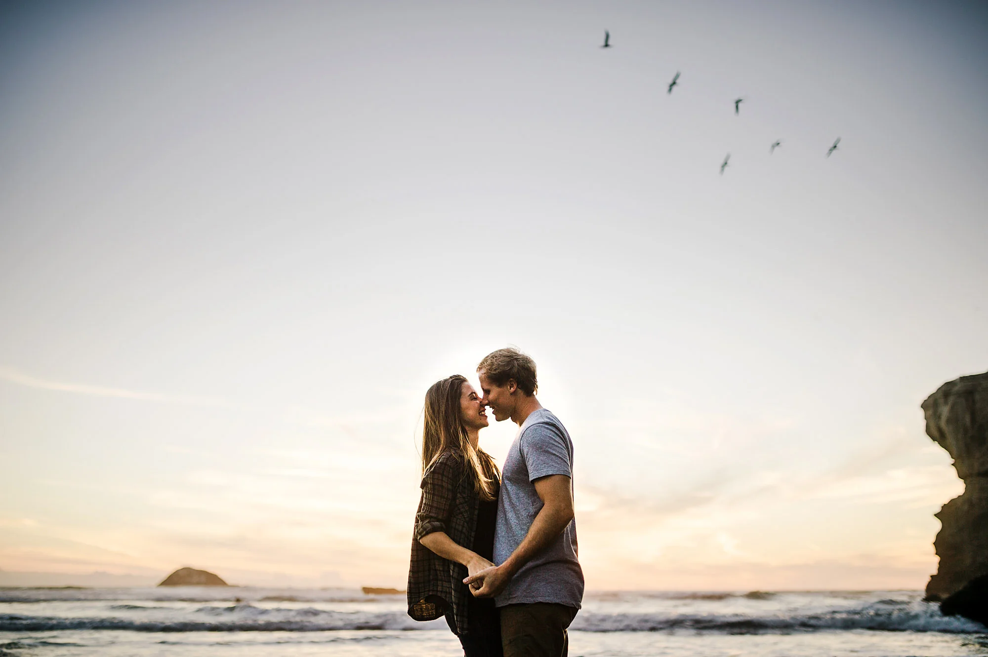 14 kissing at sunset with birds flying by.jpg