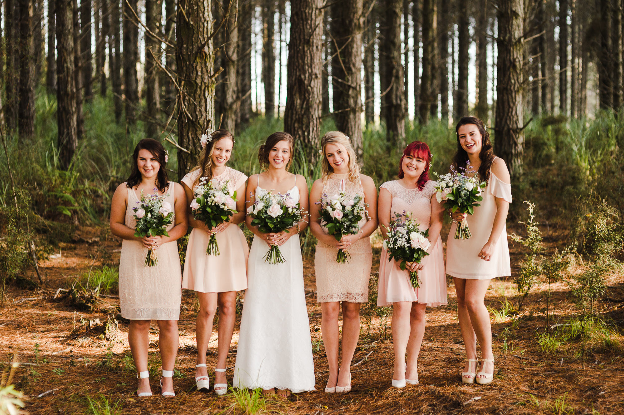 bridesmaids in pastel dresses.jpg