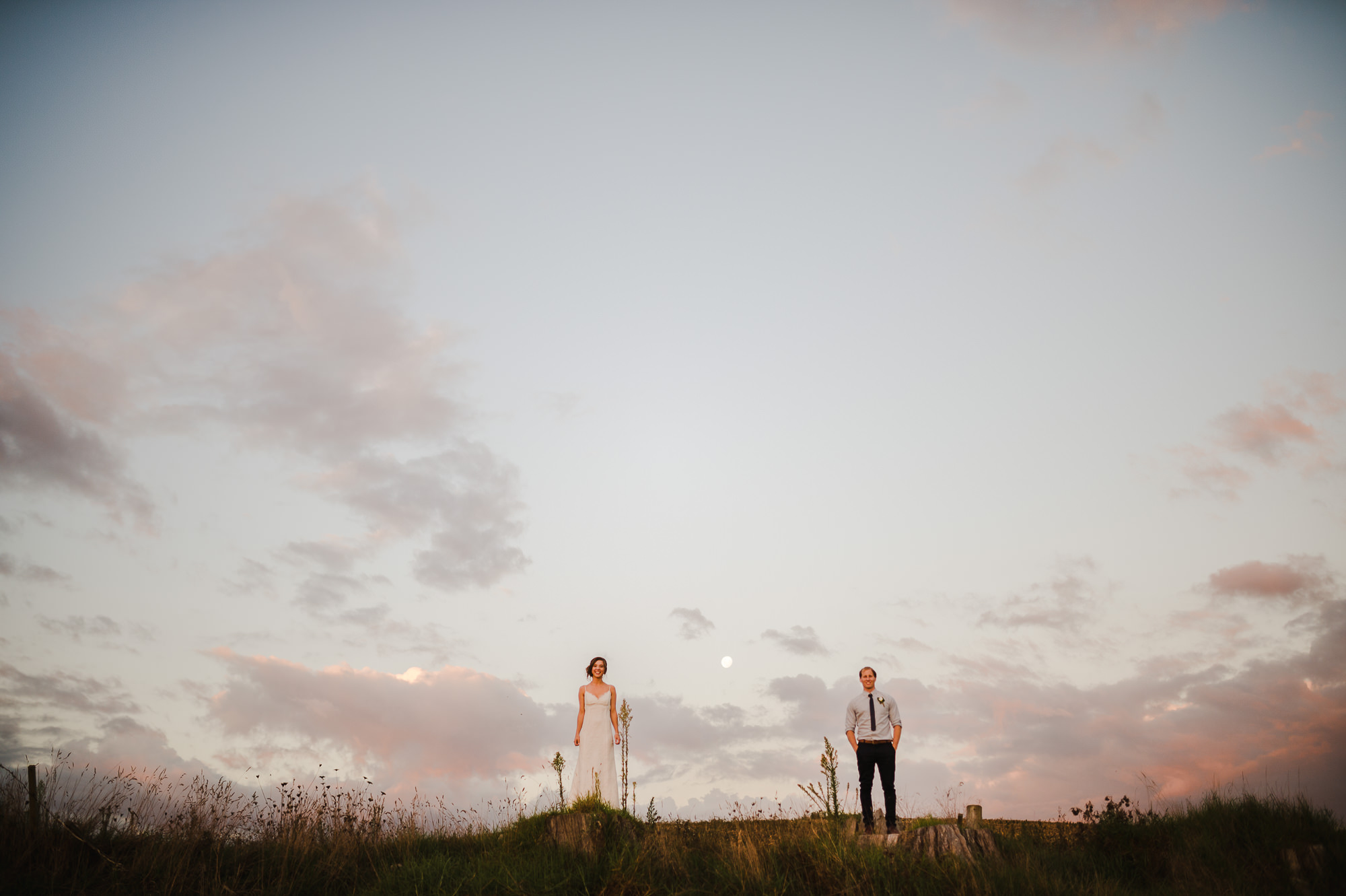 bride and groom at dusk with moon.jpg