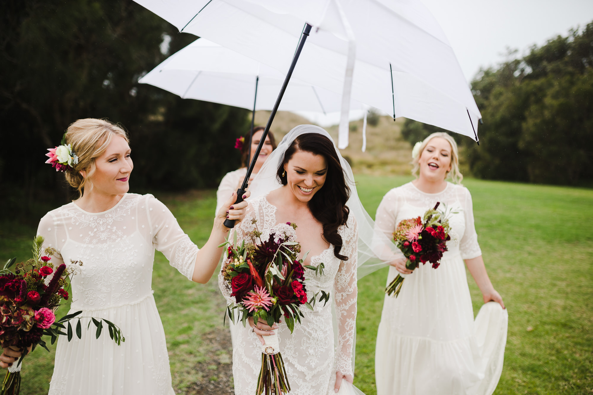 10 Documentary Moment of Bride with bridesmaids in rain.JPG