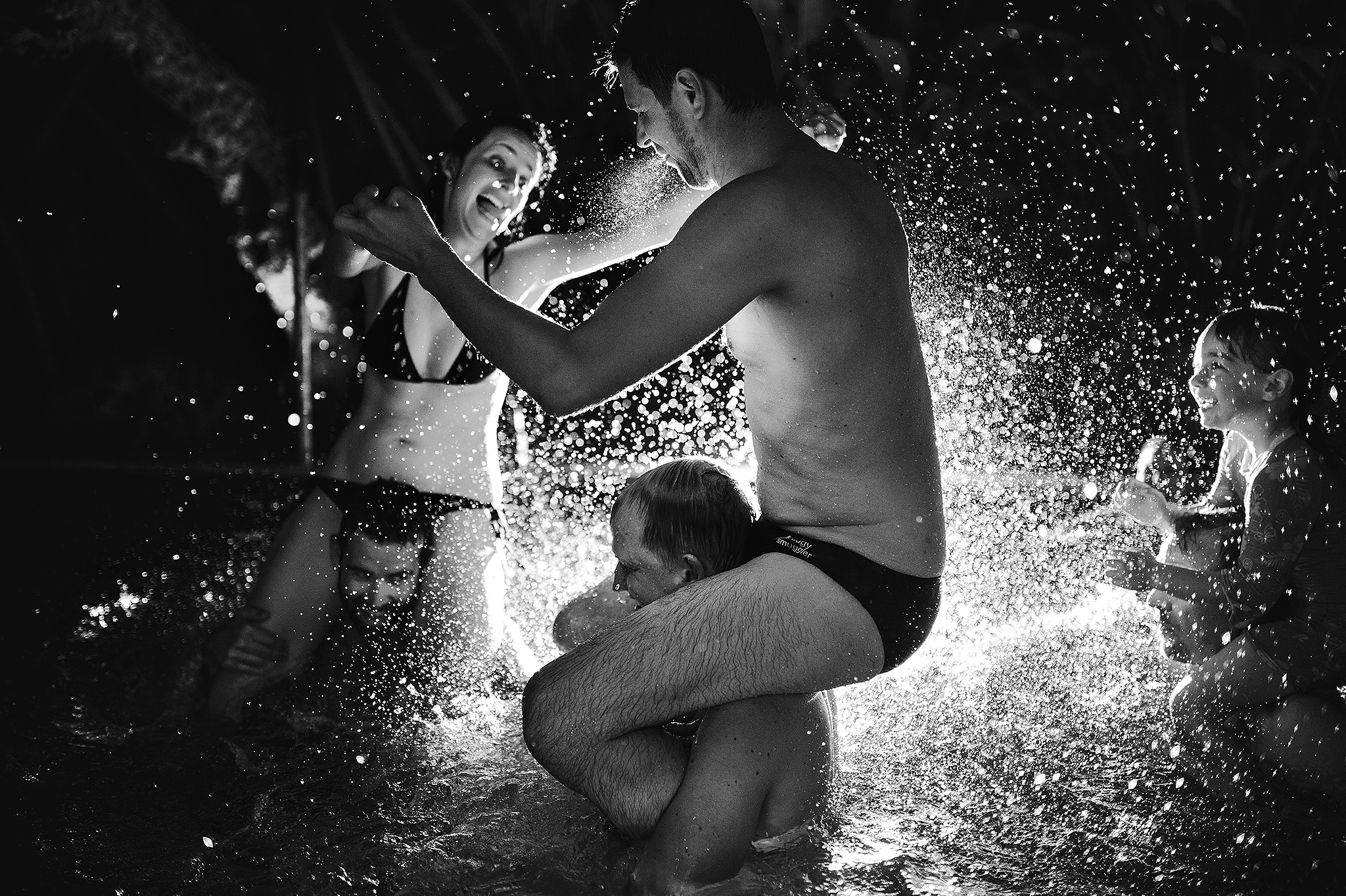 11 Documentary Moment Wedding in pool splashing epic backlit shot.JPG