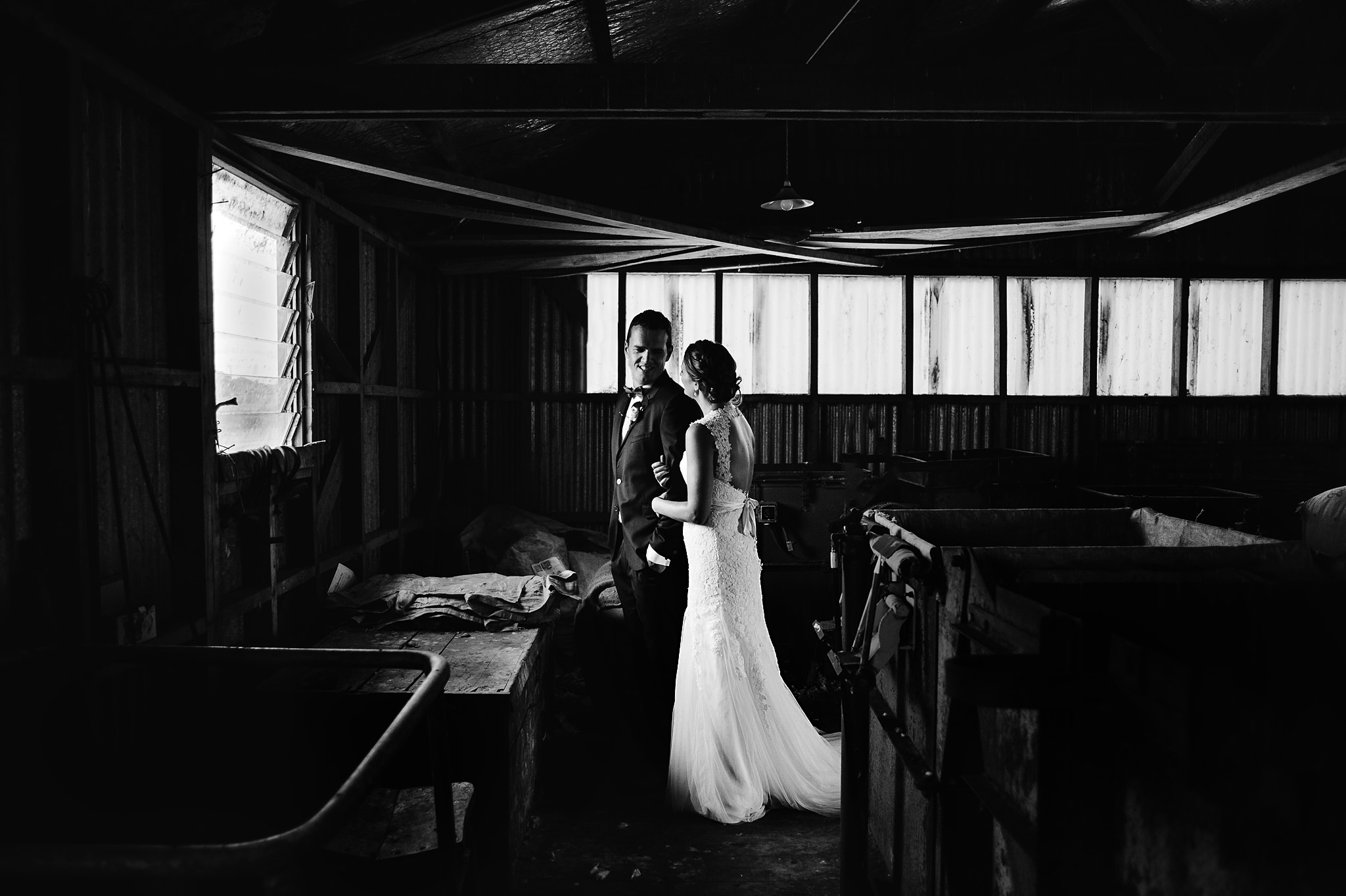 32 Bride and groom in a shearing shed moody black and white hahei wedding.JPG