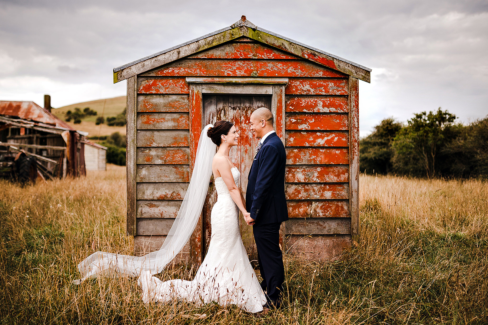 61 wedding couple in front of red barn auckland.JPG