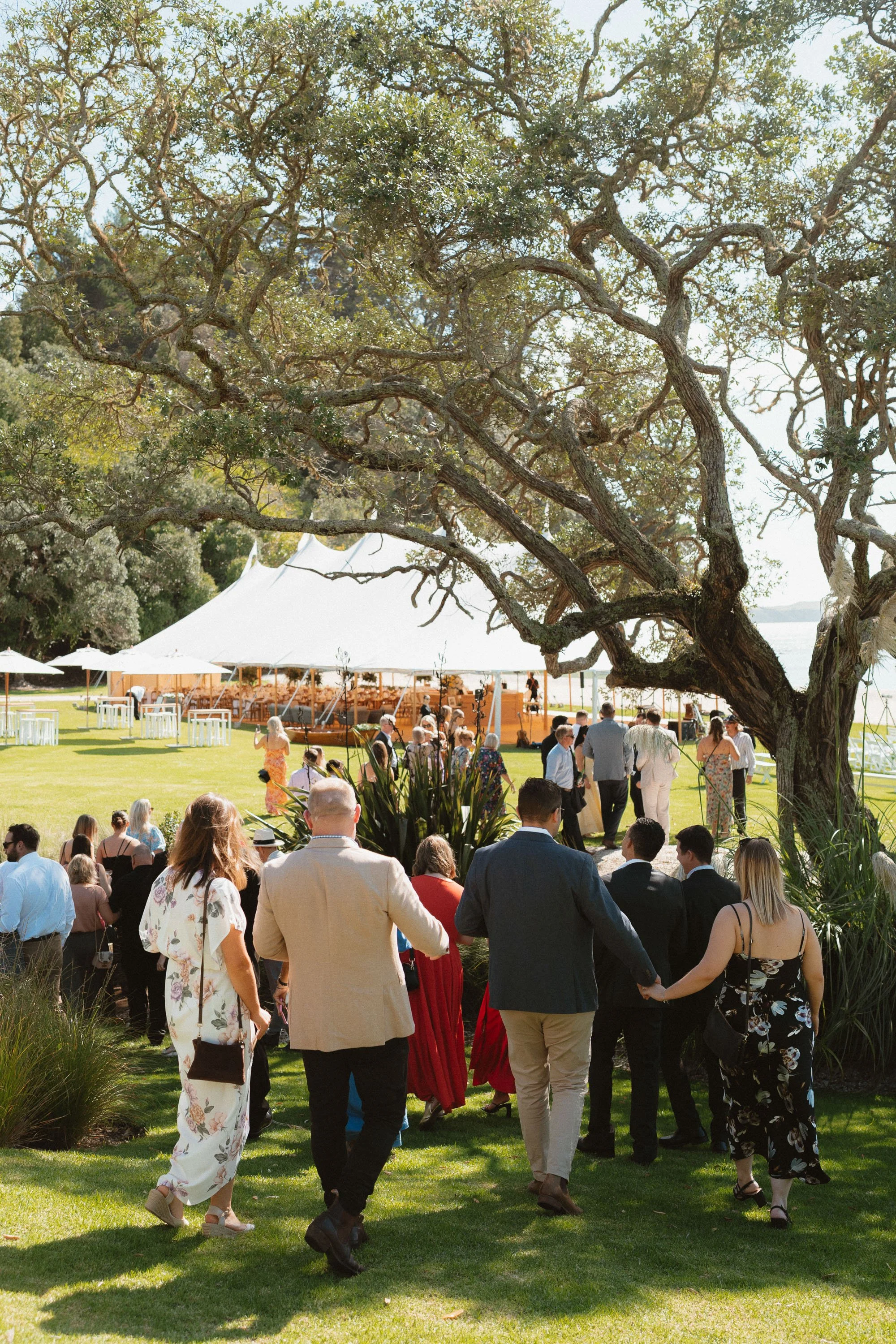 Guests walking down to ceremony location at The McCallum Residence