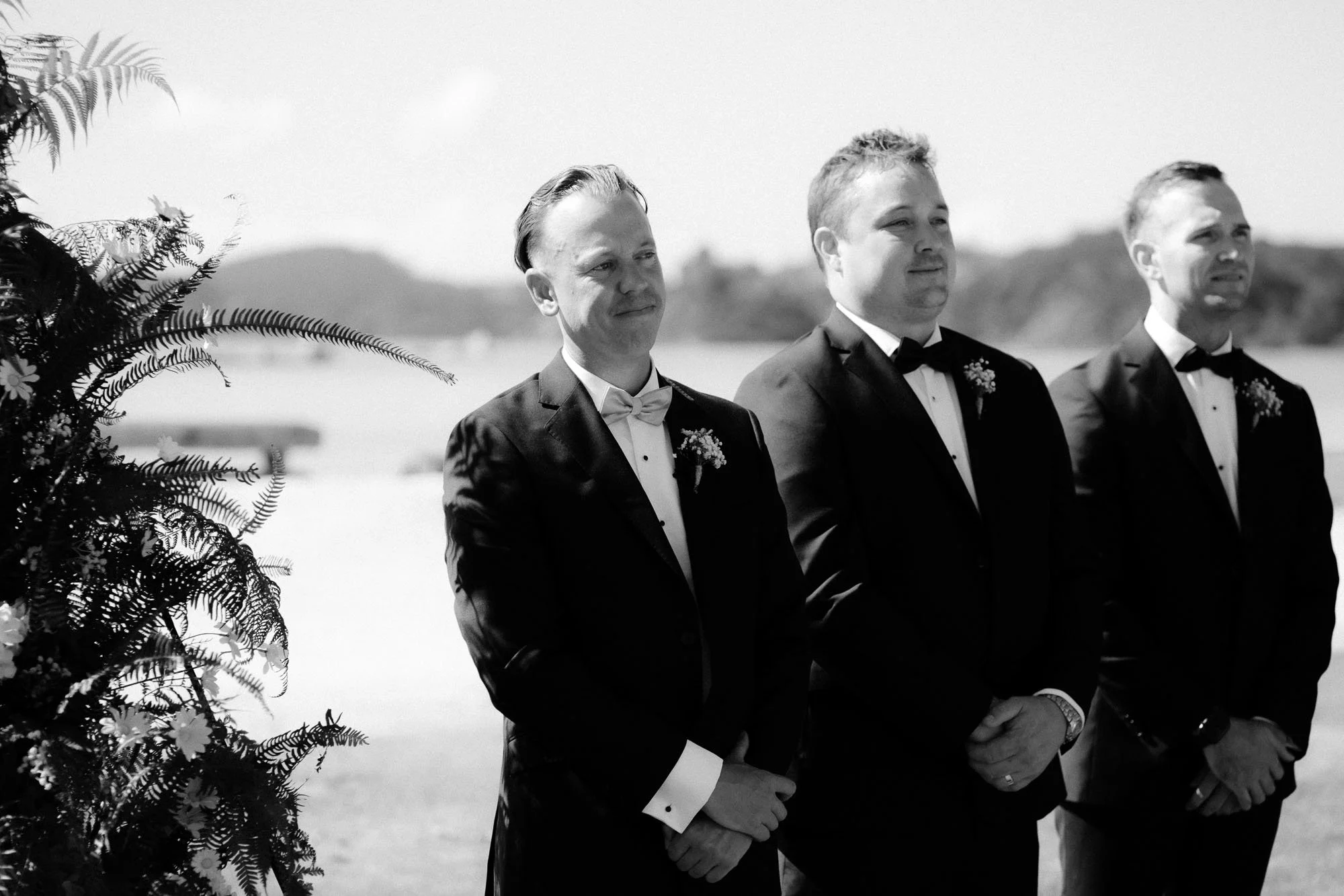 Grooms emotional reaction watching bride walk down the aisle