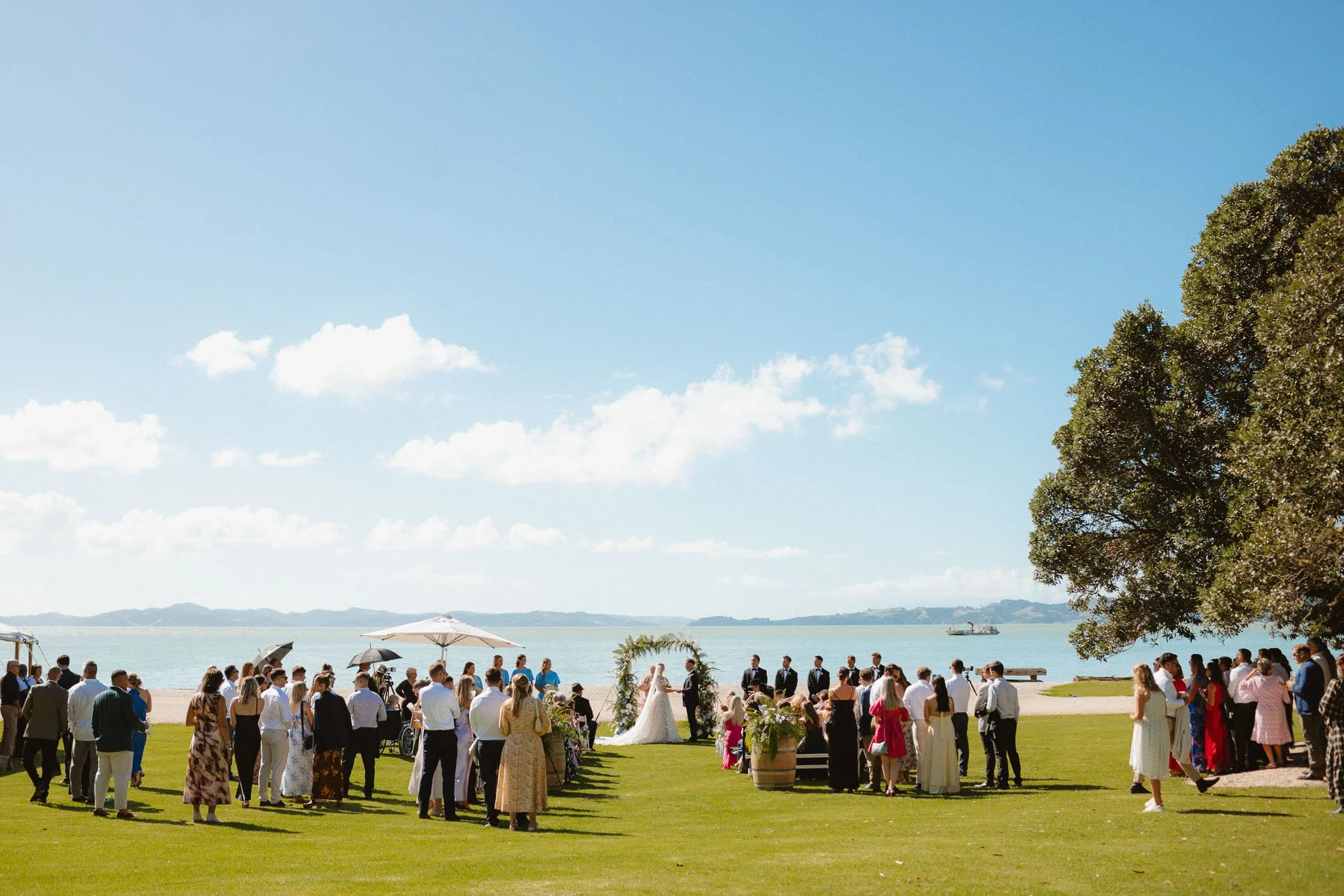 The McCallum Residence ceremony location on sunny day looking out to high tide on beach