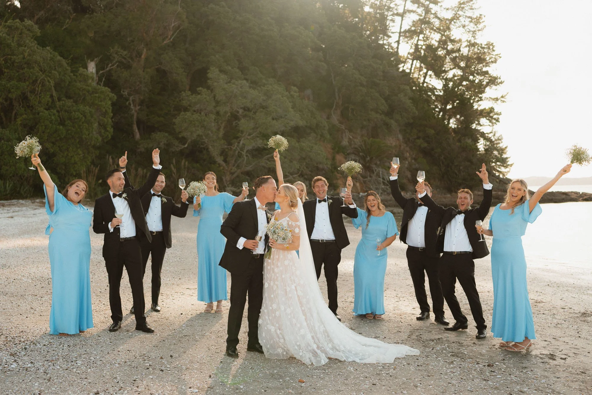 Wedding party having fun on beach at The McCallum Residence