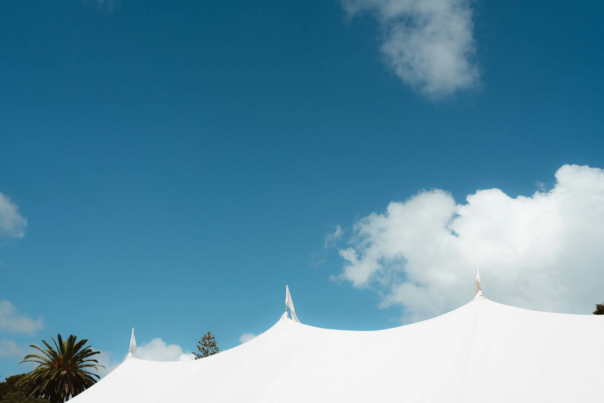 Top of Flagship Events Marquee against blue sky
