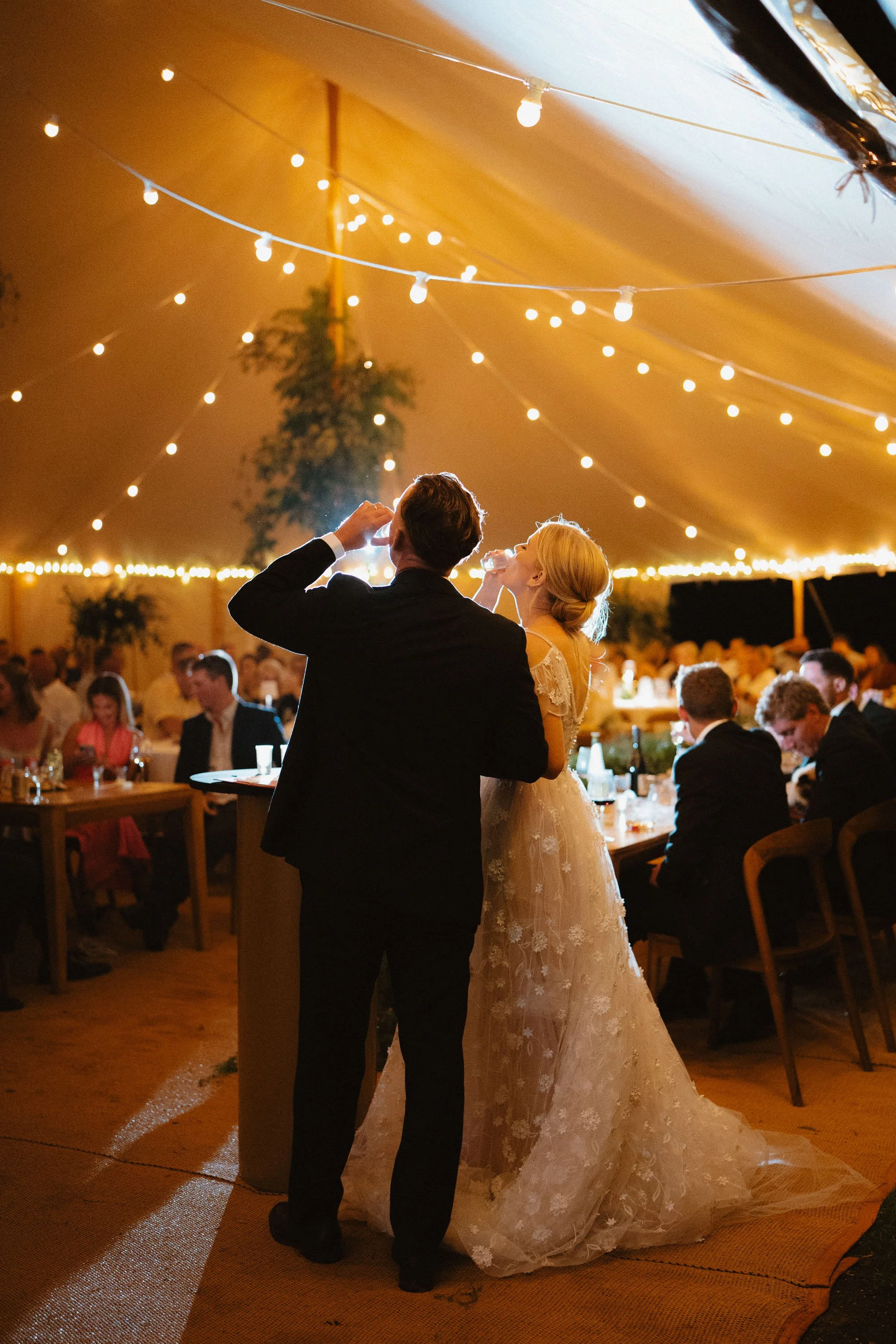 Bride and groom drinking lemoncello