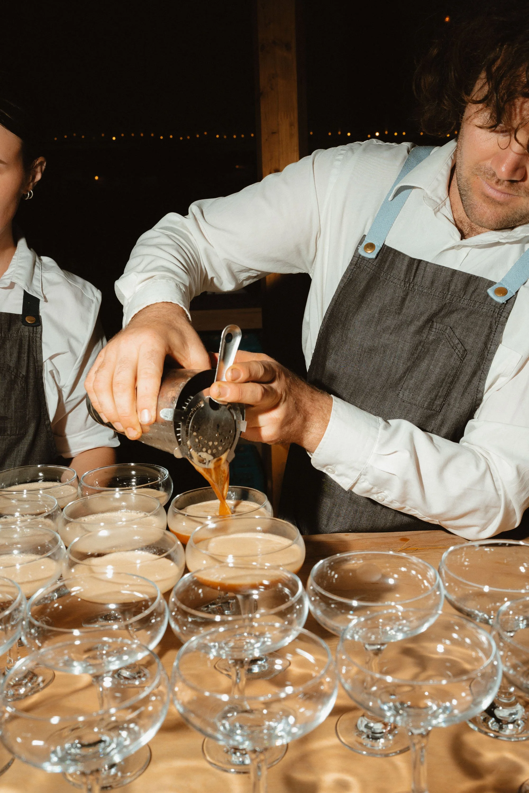 Espresso martinis being poured by Little Wolf Catering