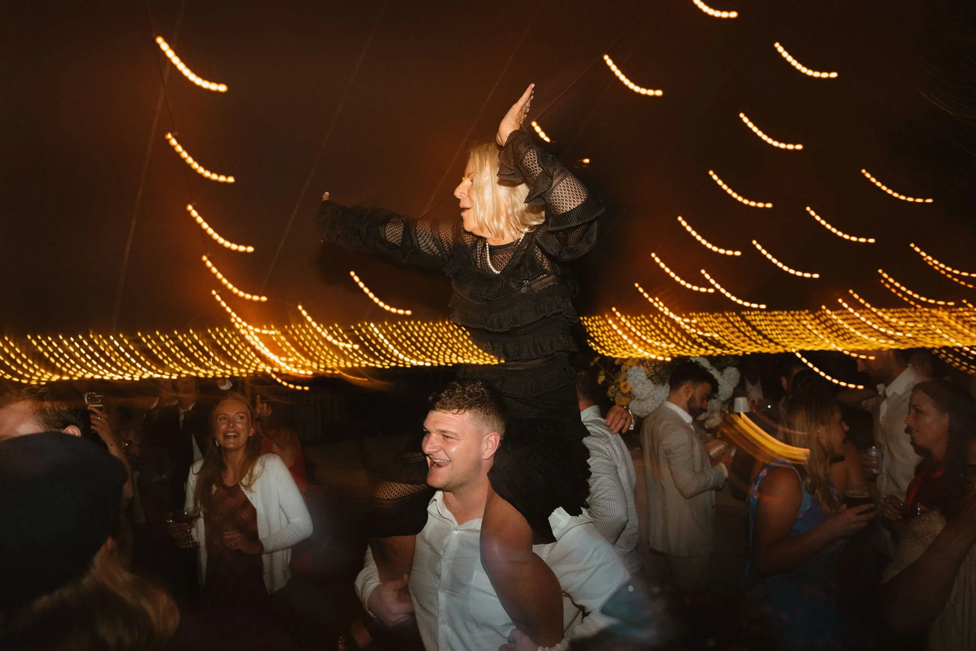 Guest on shoulders on dance floor