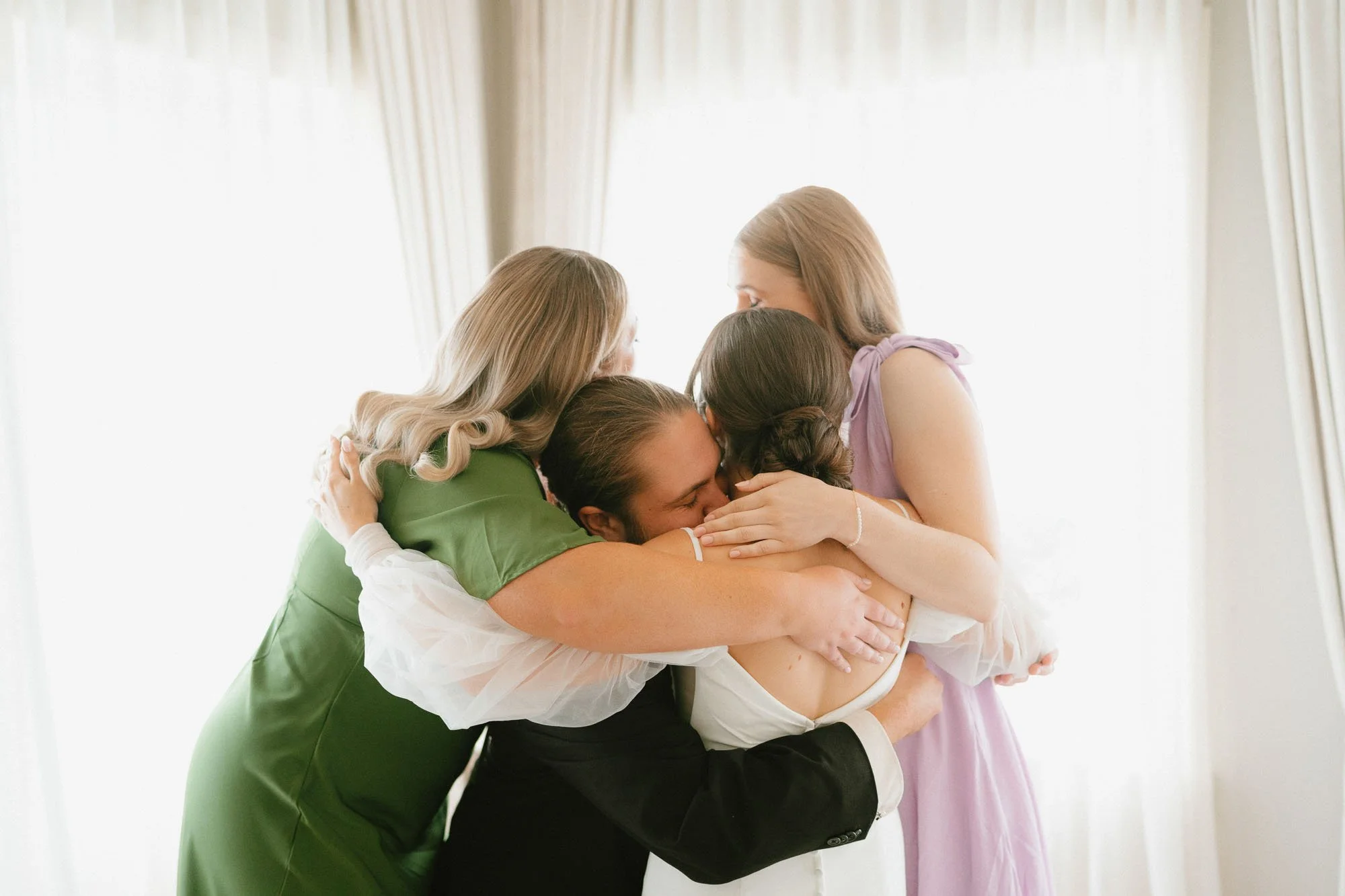 group hug at wedding