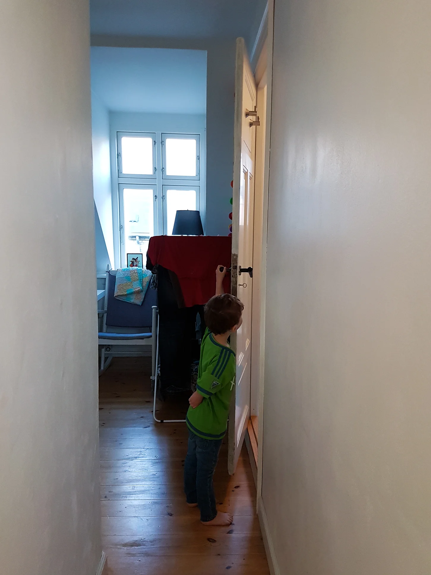 Calvin, dressed and peaking in on papa who was getting ready in the bathroom.