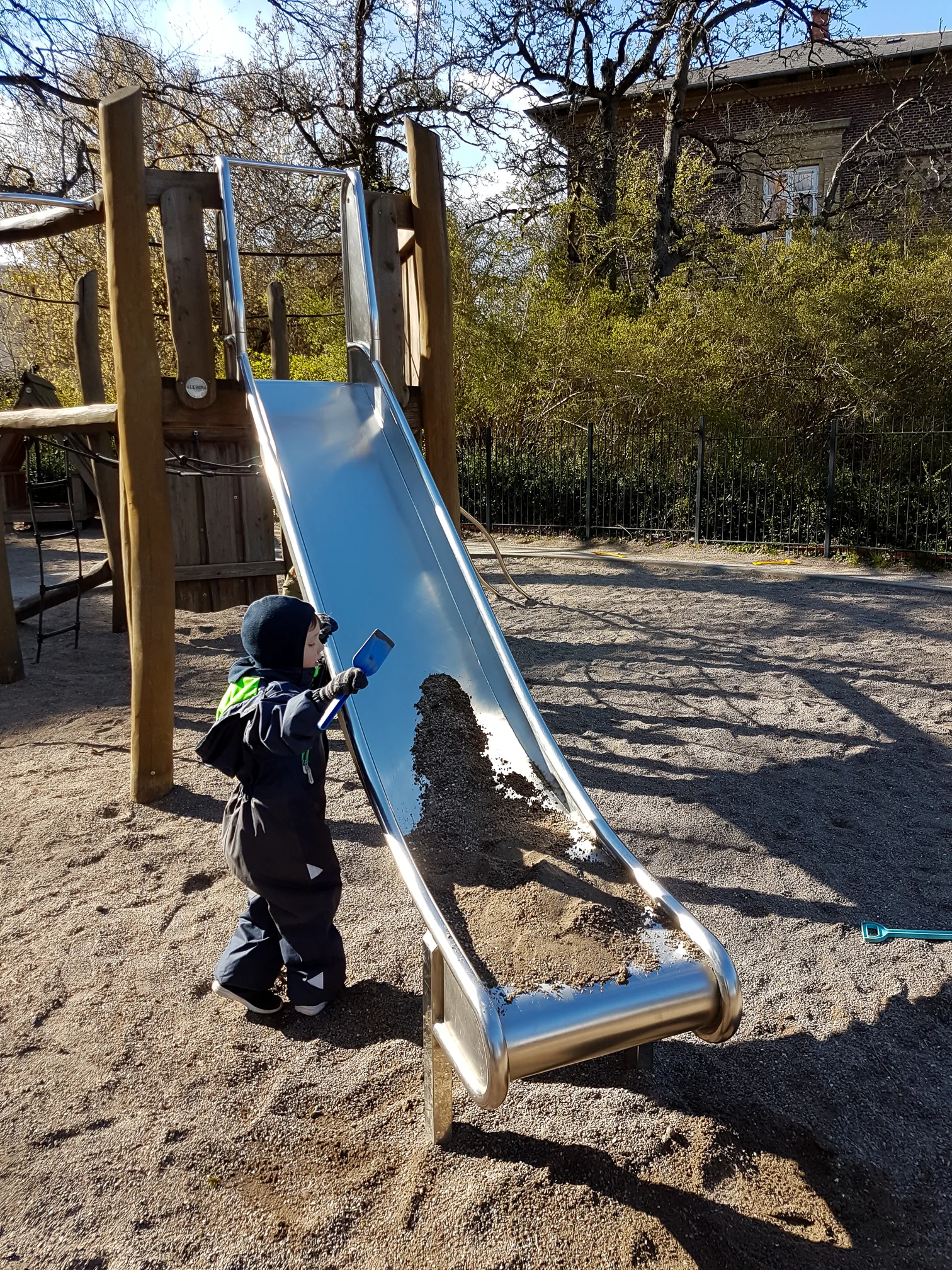 Calvin, loading the slide with sand, waiting for Egon to come and knock it off.