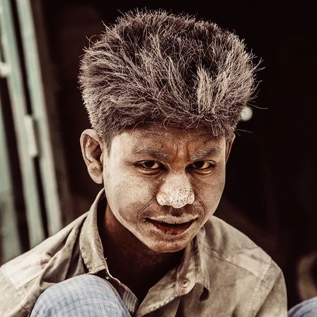 A shot from my first trip to Mandalay. A Burmese boy smiled momentarily while grinding away at a marble statue he was finishing. The boys in this district live and work in extreme conditions  often inhaling dust and chemicals while producing Buddhist