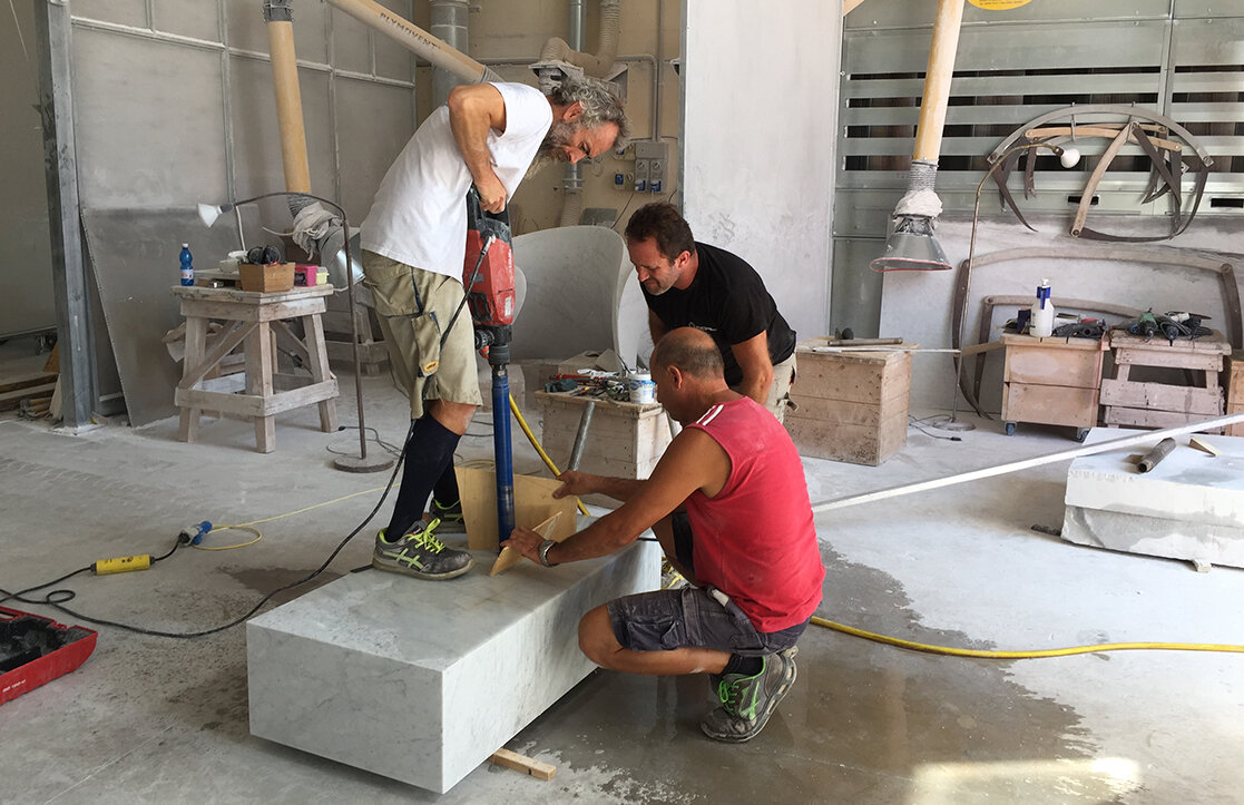 The artisans boring a hole for a large pin in a marble base