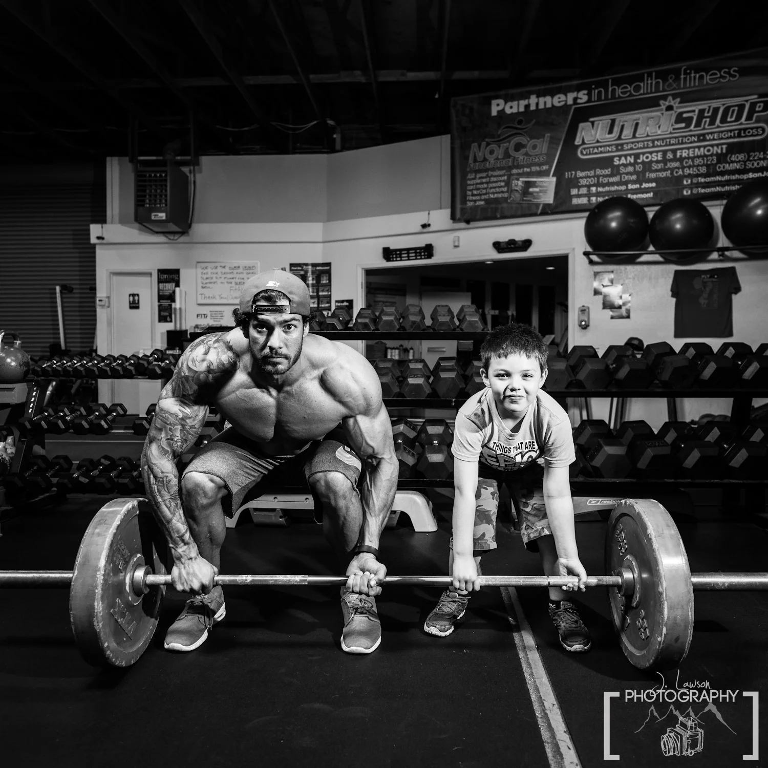 Teaching bodybuilding to a young apprentice