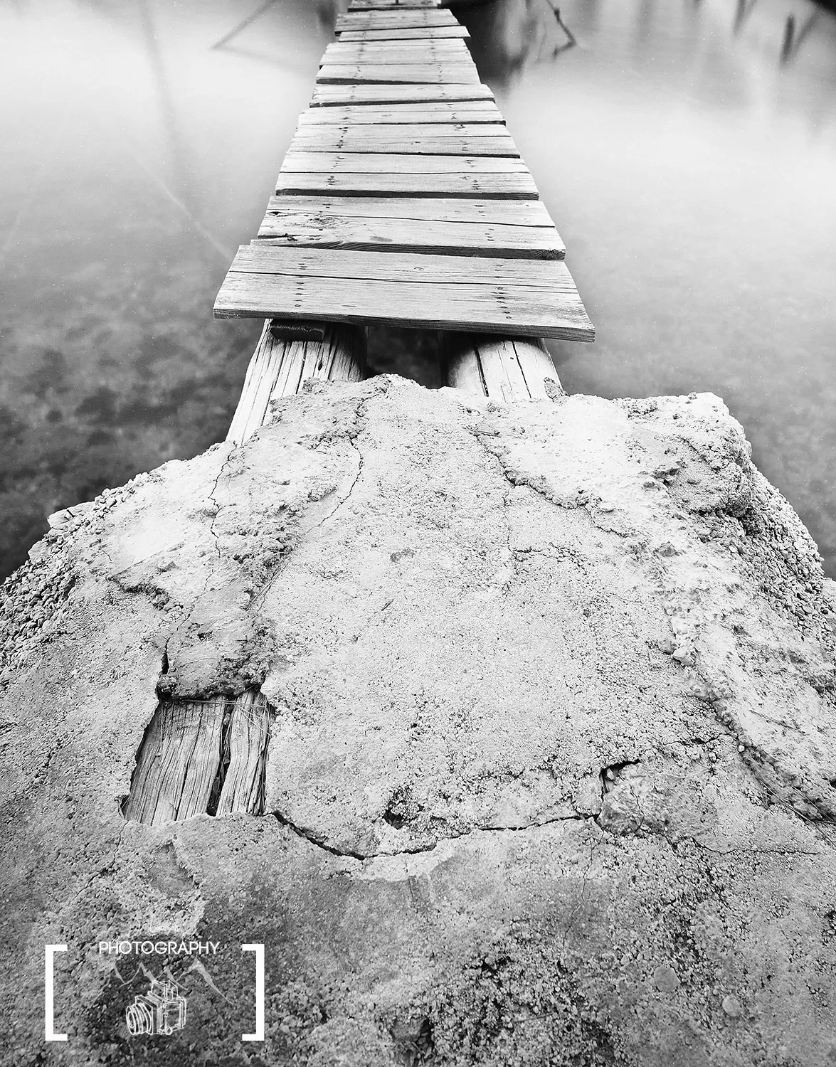 Focusing on the foreground and using long exposure gives an old pier a new look. Photograph by Jared Lawson Photography. 