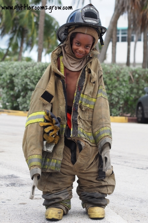 Boy in fireman suit 