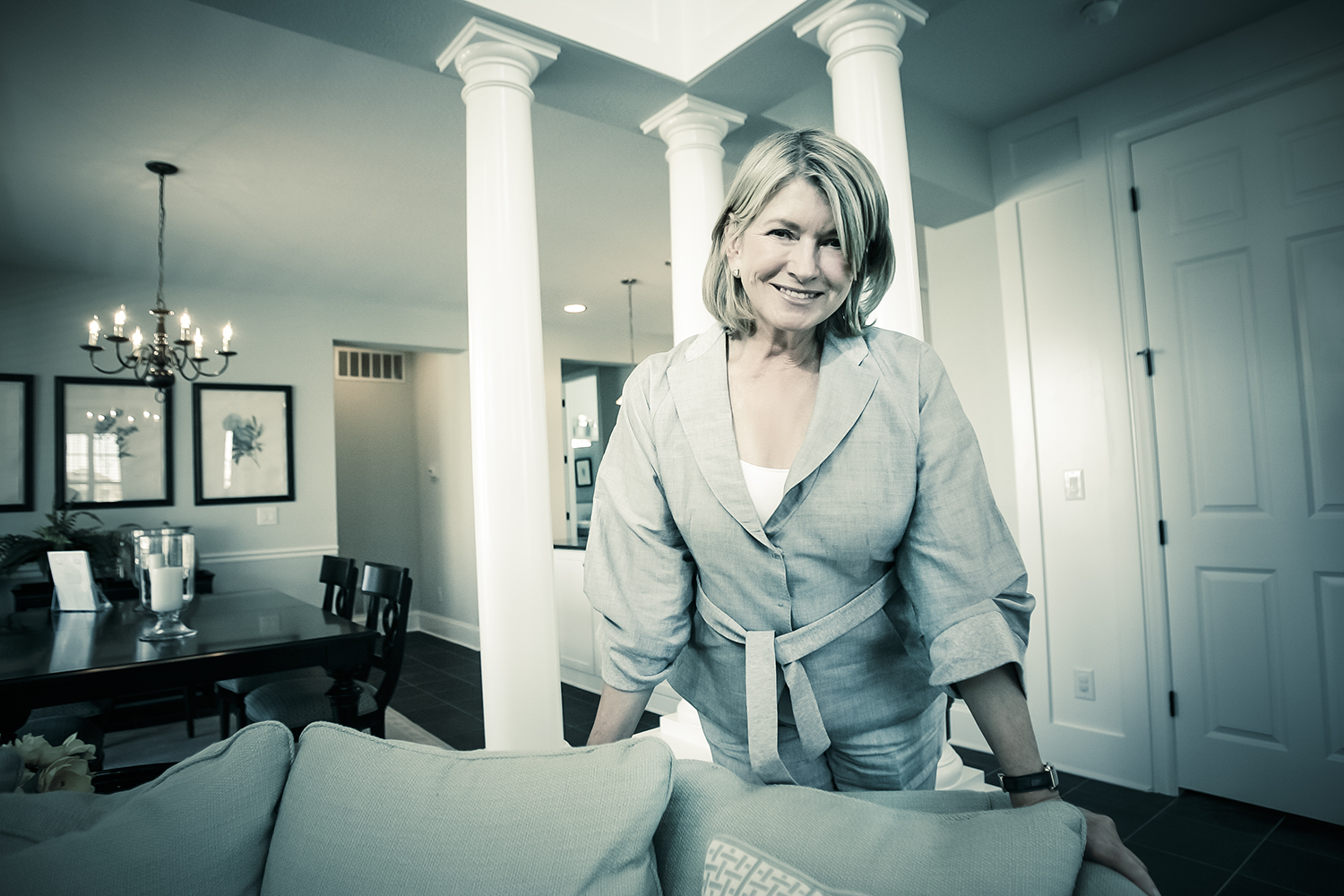 Martha Stewart stands inside a home that she helped decorate in Stapleton, Colo.(Photo by Bear Gutierrez) Martha Stewart is an American media mogul best known for her television show and magazine, Martha Stewart Living. Martha Stewart was born on August 3, 1941, in Jersey City, New Jersey. Stewart rose to prominence as the author of books on cooking, entertaining and decorating. She then expanded her brand to include a magazine and television program, serving as CEO of Martha Stewart Omnimedia. Stewart resigned her post in 2002, following charges of insider trading of which she was subsequently convicted. Lifestyle Guru Lifestyle guru and businesswoman Martha Stewart was born Martha Kostyra, on August 3, 1941, in New Jersey. The second of six children, Stewart grew up in Nutley, New Jersey, a working-class community near New York City. She worked as a model from the age of 13, appearing in fashion shows as well as television and print advertisements. Stewart attended Barnard College in Manhattan, where she earned a degree in European and architectural history in 1962. While at Barnard, she met Andy Stewart, a Yale law student, and the two married in 1961. Six years later, after the birth of their daughter, Alexis, Stewart went to work as a stockbroker for the boutique firm of Monness, Williams, and Sidel. She worked on Wall Street until 1972, when the family moved to Westport, Connecticut. After the Stewarts restored the 19th century farmhouse they had bought, Martha decided to focus her energy on gourmet cooking, having trained herself by reading Julia Child's Mastering the Art of French Cooking. She started a catering business in the late 1970s, and soon became known for her gourmet menus and unique, creative presentation. Within a decade, Martha Stewart, Inc., had grown into a $1 million business serving a number of corporate and celebrity clients. Stewart expanded into the world of publishing with her first book, Entertaining, which became a bestseller and was followed in quick succession by such publications as Martha Stewart's Quick Cook Menus, Martha Stewart's Hors d'Oeuvres, Martha Stewart's Christmasand Martha Stewart's Wedding Planner. Her newfound fame took its toll on her personal life, as her marriage to Andy Stewart ended in divorce in 1990, after a bitter three-year separation. In 1991, Martha Stewart, Inc., became Martha Stewart Living Omnimedia, Inc., with the release of her magazine, Martha Stewart Living. Stewart's lifestyle empire soon grew to include two magazines, a checkout-size recipe publication, a popular cable television show, a syndicated newspaper column, a series of how-to books, a radio show, an Internet site and $763 million in annual retail sales. On October 19, 1999, America's most famous homemaker returned to Wall Street to see her company through its initial public offering on the New York Stock Exchange. At the end of the day, the price of each of 72 million shares in Martha Stewart Living Omnimedia, Inc. had jumped more than 95 percent and raised almost $130 million. Stewart herself controls 96 percent of the voting shares in her company and is worth $1.2 billion. Insider Trading Scandal In June 2002, Stewart again made financial headlines, this time for rumors of insider trading. Stewart was under investigation for selling hundreds of shares of ImClone Systems just prior to the Food and Drug Administration's refusal to approve the company's new cancer drug. The value of the stock dropped markedly after the FDA's announcement. Due to the investigation, Stewart resigned from the board of directors of the New York Stock Exchange in October, just four months after she had joined. In June 2003, a 41-page indictment charged Stewart with securities fraud, obstruction of justice, conspiracy and making false statements to prosecutors and the FBI. She pleaded innocent to all charges and stepped down as chair and CEO of her Omnimedia empire. In February 2004, a judge dismissed the securities fraud charge, but a jury found her guilty of conspiracy, obstruction of justice and two counts of making false statements. Martha Stewart was sentenced to five months in prison and fined $30,000 that July. She served the first part of her sentence at a minimum-security prison in Alderson, West Virginia, in October 2004. Later Career Stewart was released from prison on March 4, 2005, just after NBC announced she would host two new shows: a daytime talk and how-to show and a spin-off of the reality show The Apprentice produced by Mark Burnett and Donald Trump. Stewart finished her sentence by serving five months of house arrest at her home in Bedford, New York. While Martha Stewart's version of The Apprentice failed to attract enough viewers, her self-titled syndicated daytime program has been on the air since 2005. The company she established, Martha Stewart Omnimedia, continued to grow in new directions. The business added several non-Martha Stewart publications, including Everyday Food and Body + Soul. Professional Woes Stewart's syndicated show moved to the Hallmark Channel in 2010, but it failed to develop enough of an audience to sustain the expensive-to-produce program. Hallmark canceled the show in 2012 because of low ratings. That fall, Stewart launched a new series on PBS called Martha Stewart's Cooking School. In 2013, Stewart found herself inside a courtroom once again. Her company was engaged in a lawsuit with the department store chain Macy's over a contract dispute. Macy's sued Stewart and its retail rival J.C. Penney over Stewart's plan to open Martha Stewart brand boutiques inside Penney's stores.